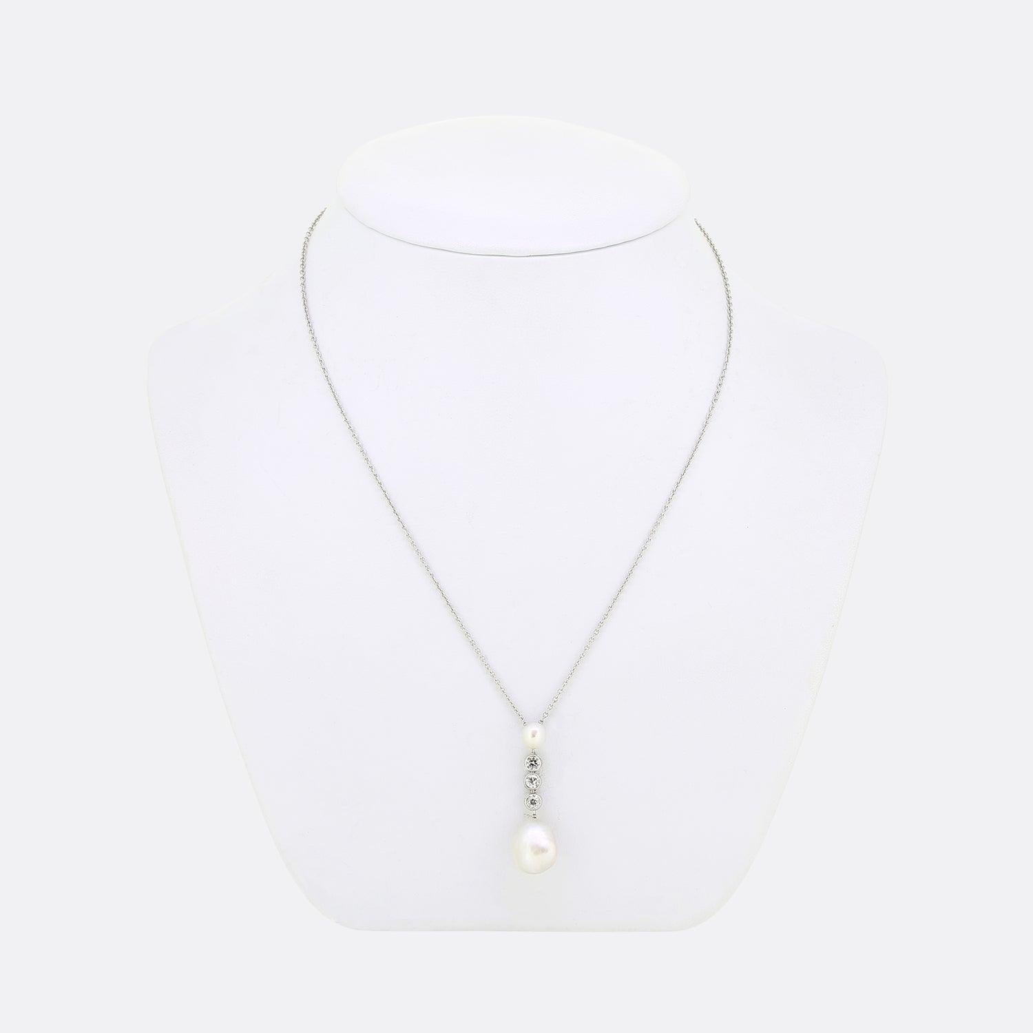 Here we have a vintage platinum pearl and diamond necklace. Hanging from a platinum belcher chain we find a duo of  natural salt water pearls, the largest of which is oval-button shaped whilst the other is round. Both pearls have been two-part