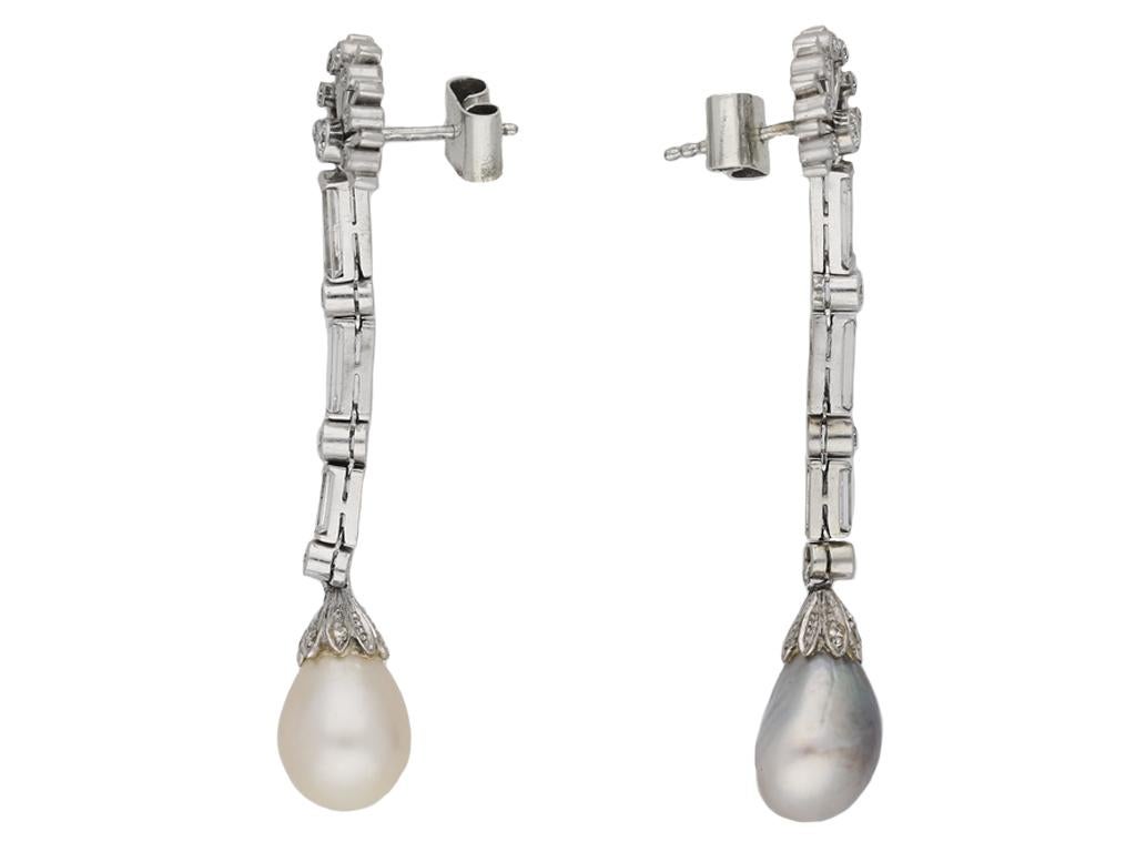 Vintage natural pearl and diamond earrings. A matching pair of earrings, each set with one drop shape natural saltwater pearl, one cream colour, approximately 11.9 x 9.0 x 8.9mm, one grey colour, approximately 11.9 x 9.4 x 8.4mm, further set with