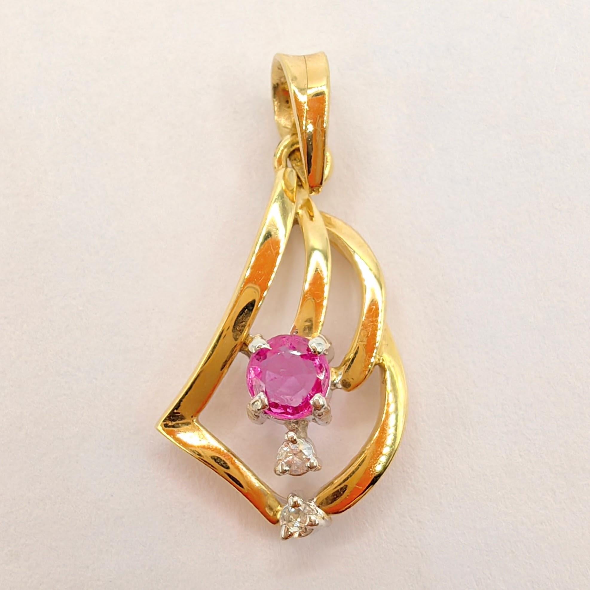 Introducing our Vintage Natural Pink Sapphire Diamond Necklace Pendant in 14K Yellow Gold, a stunning piece that combines the allure of precious gemstones with the timeless elegance of vintage design.

At the heart of this pendant lies a captivating