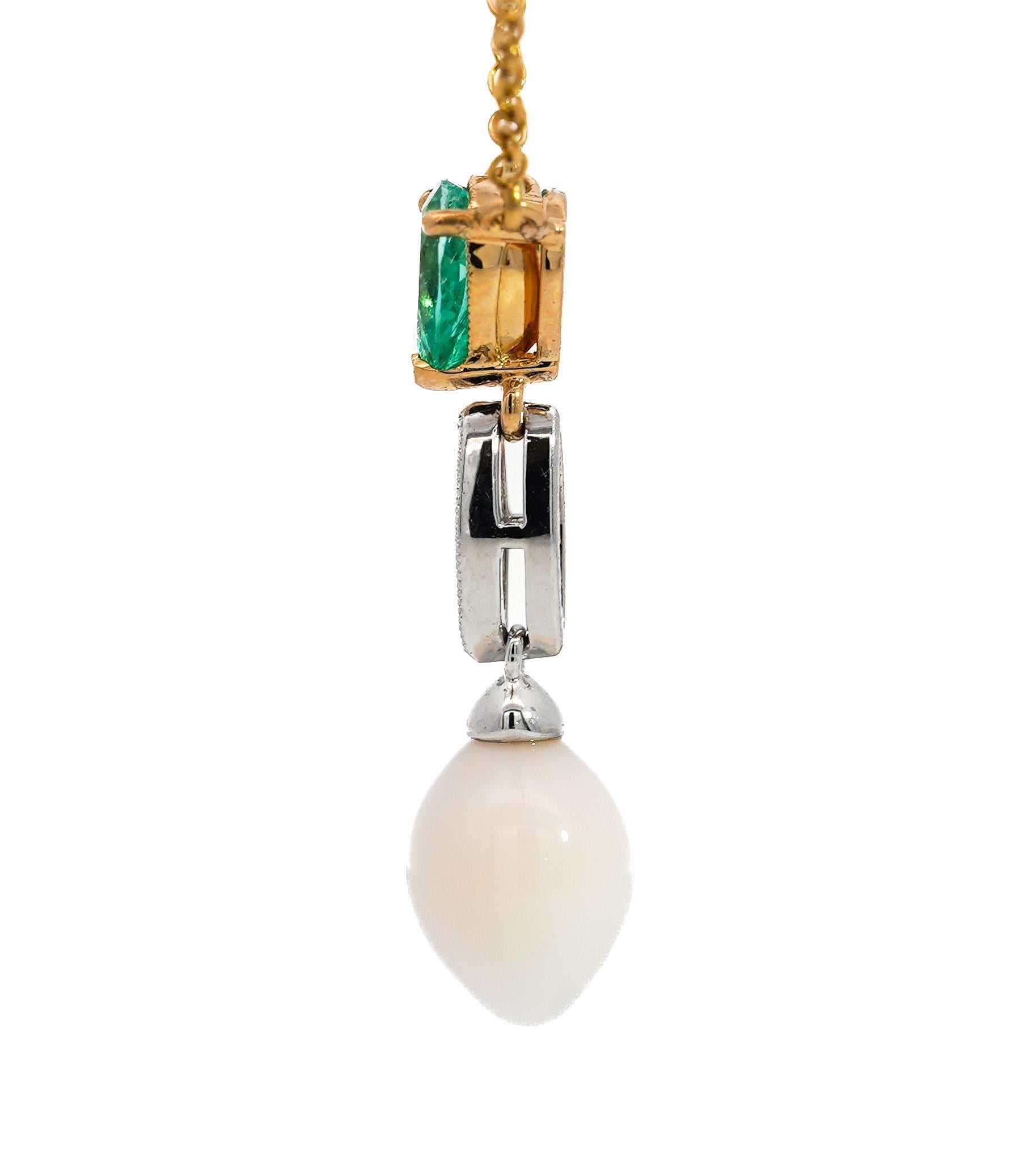 Vintage GIA certified natural saltwater conch pearl, emerald, and diamond drop pendant necklace in 18k yellow gold. Set on an 18 inch cable chain with a secure closure. 3-Prong set pear cut natural emerald. Marquise cut diamond in a milgrain bezel