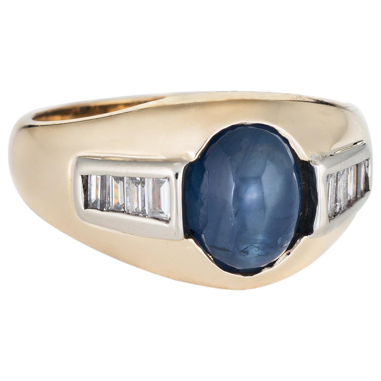 A 9K yellow gold 8 blue sapphire cabachon ring. Gold sapphire ring