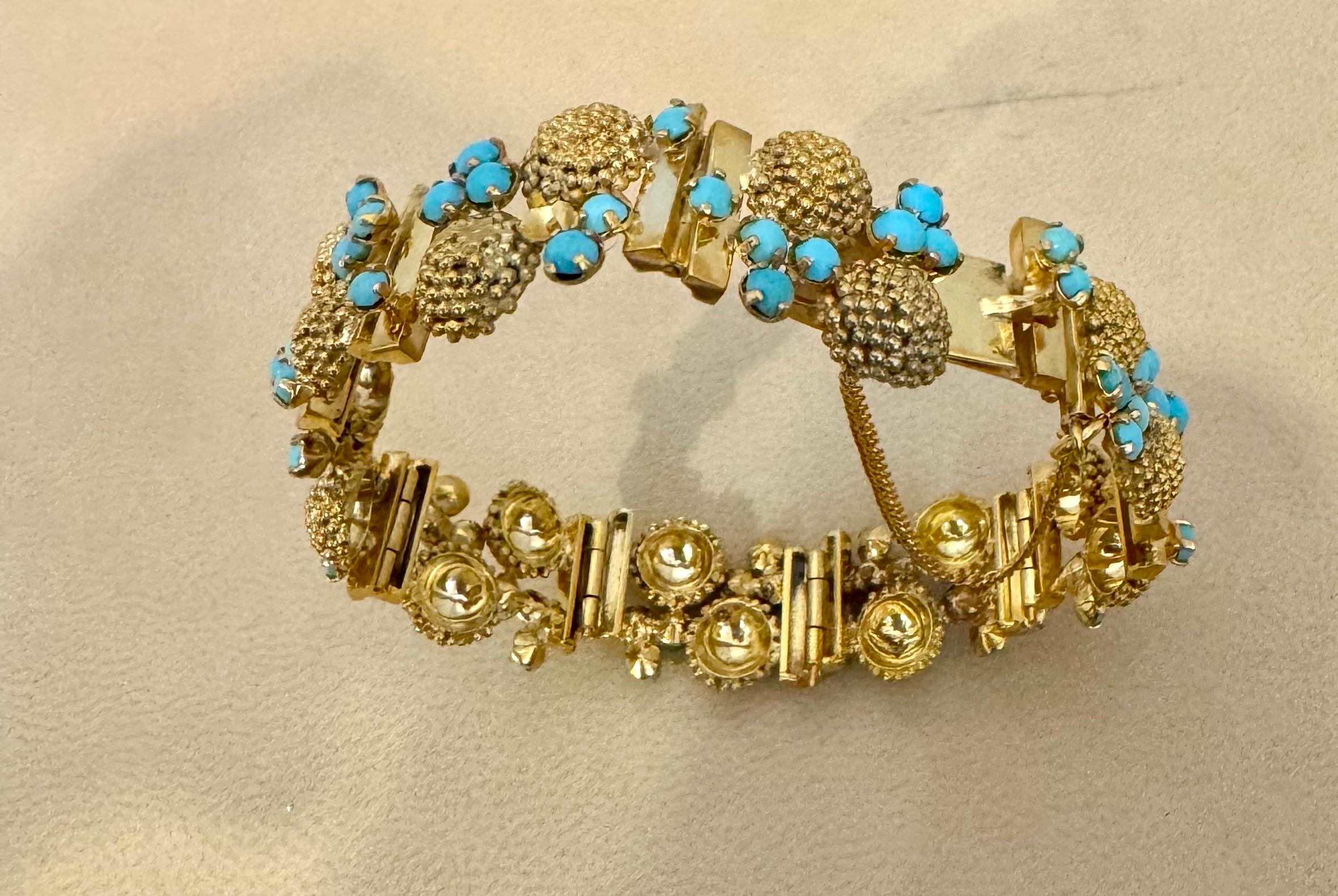 Vintage Natural Turquoise  Bangle /Bracelet in 14 Kt Yellow Gold 39.4 Grams, 8 inch long

A flexible   bangle bracelet from our Estate collection is bright with 72 round turquoise cabochons in decorative stations. 
Solid make in 14 Karat Yellow gold