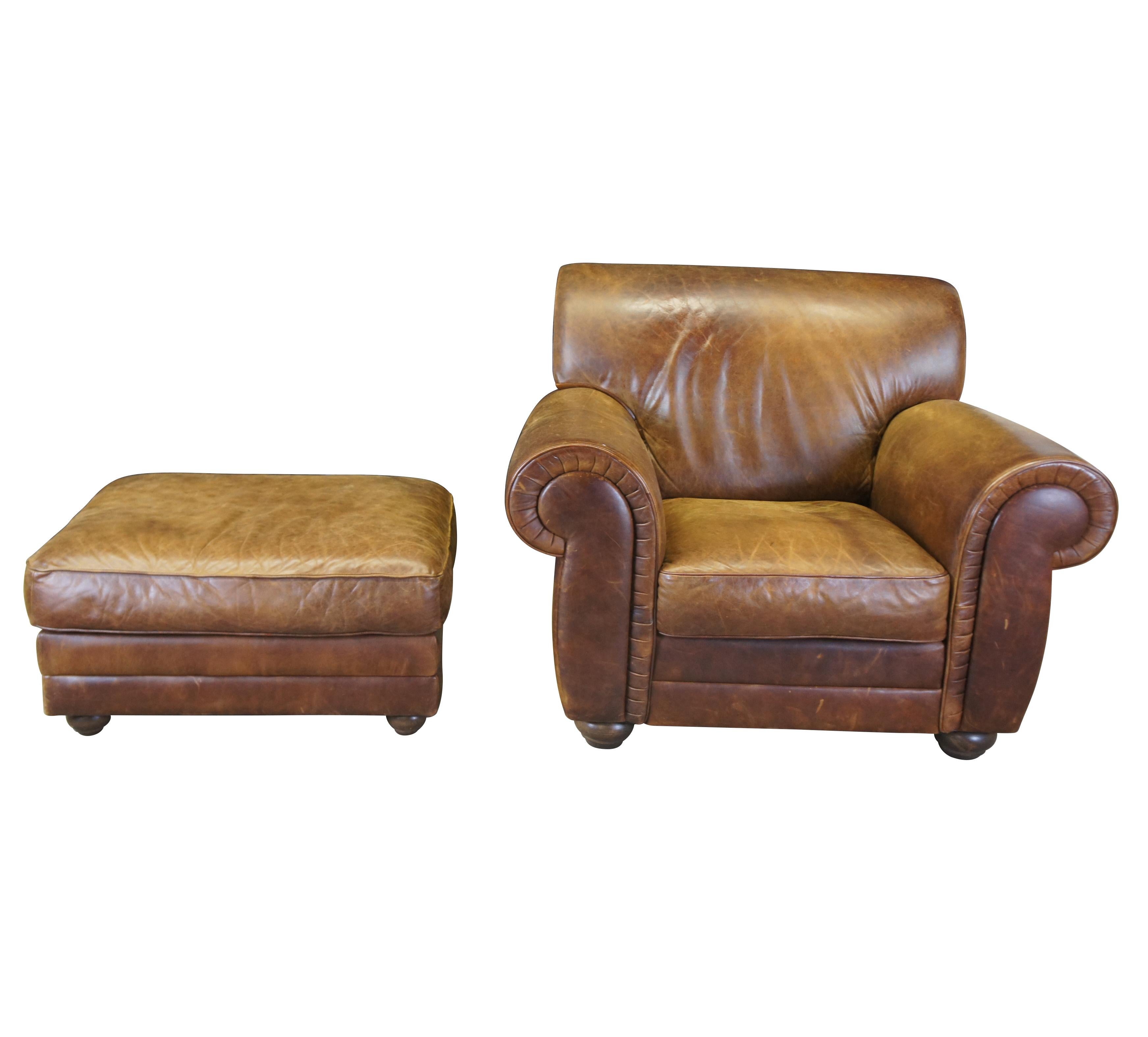 Vintage Natuzzi brown leather library club chair and ottoman featuring rolled arms and back, with bun feet and natural distressing. Made in Italy, circa 2000. 

Natuzzi Group is an Italian furniture company founded in 1959 by Pasquale Natuzzi, the
