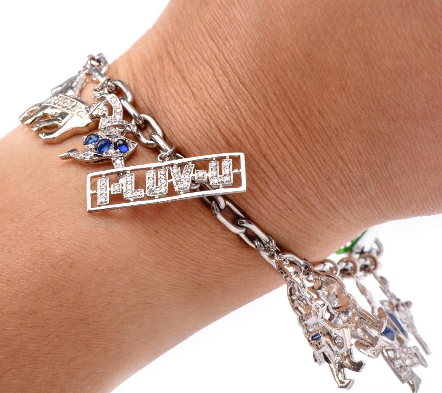 This Vintage nautical-themed diamond, sapphire, emerald, and ruby charm bracelet is crafted in solid platinum. Composed of interlocking heavy oval-shaped links. The bracelet is enriched with eleven charms including a pave diamond and sapphire
