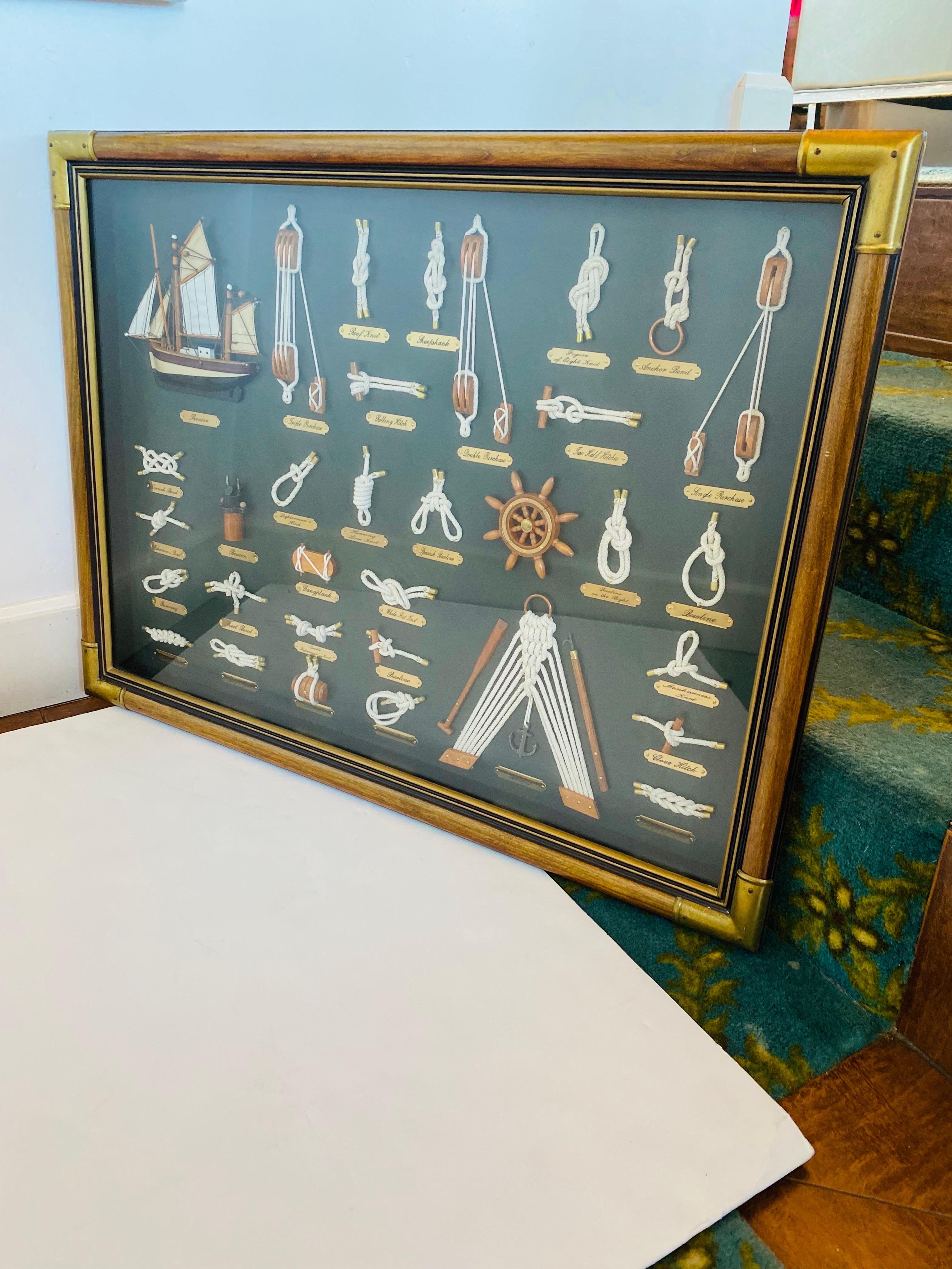 Rare vintage large original sailor's nautical knots shadow box frame.  Beautiful and artful display of different knot styles with brass detailing naming each convention.  The shadow box is beautifully framed from wood with exquisite brass accents