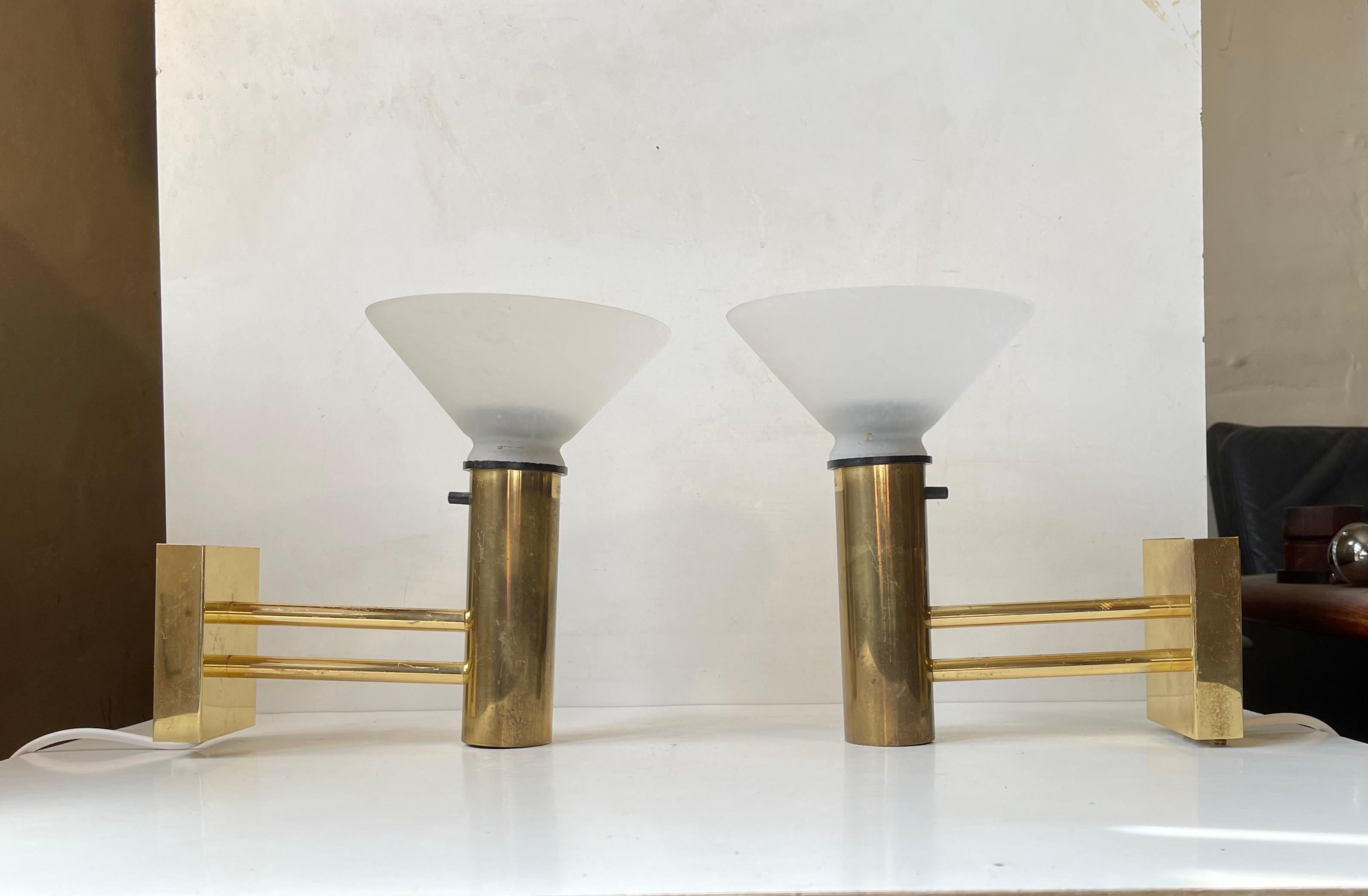 A Pair of 1970s Nautical - Navy sconces composed of brass and mounted with white textured glass shades. These lights comes from a norwegian Navy Ship (No: sjøforsvaret). The HV initials within a crown labeled to the base of each light indicate this