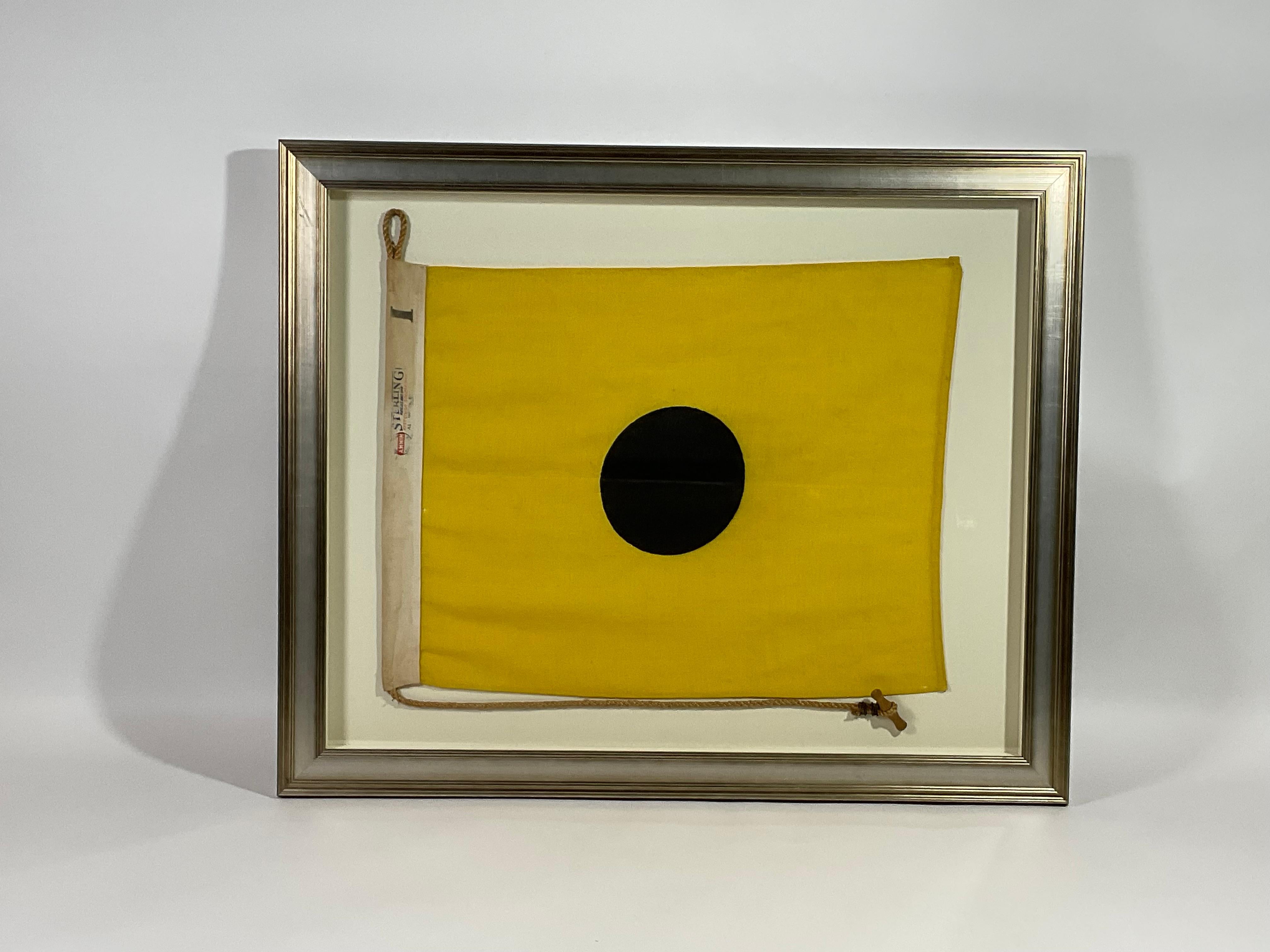 yellow flag with black dot