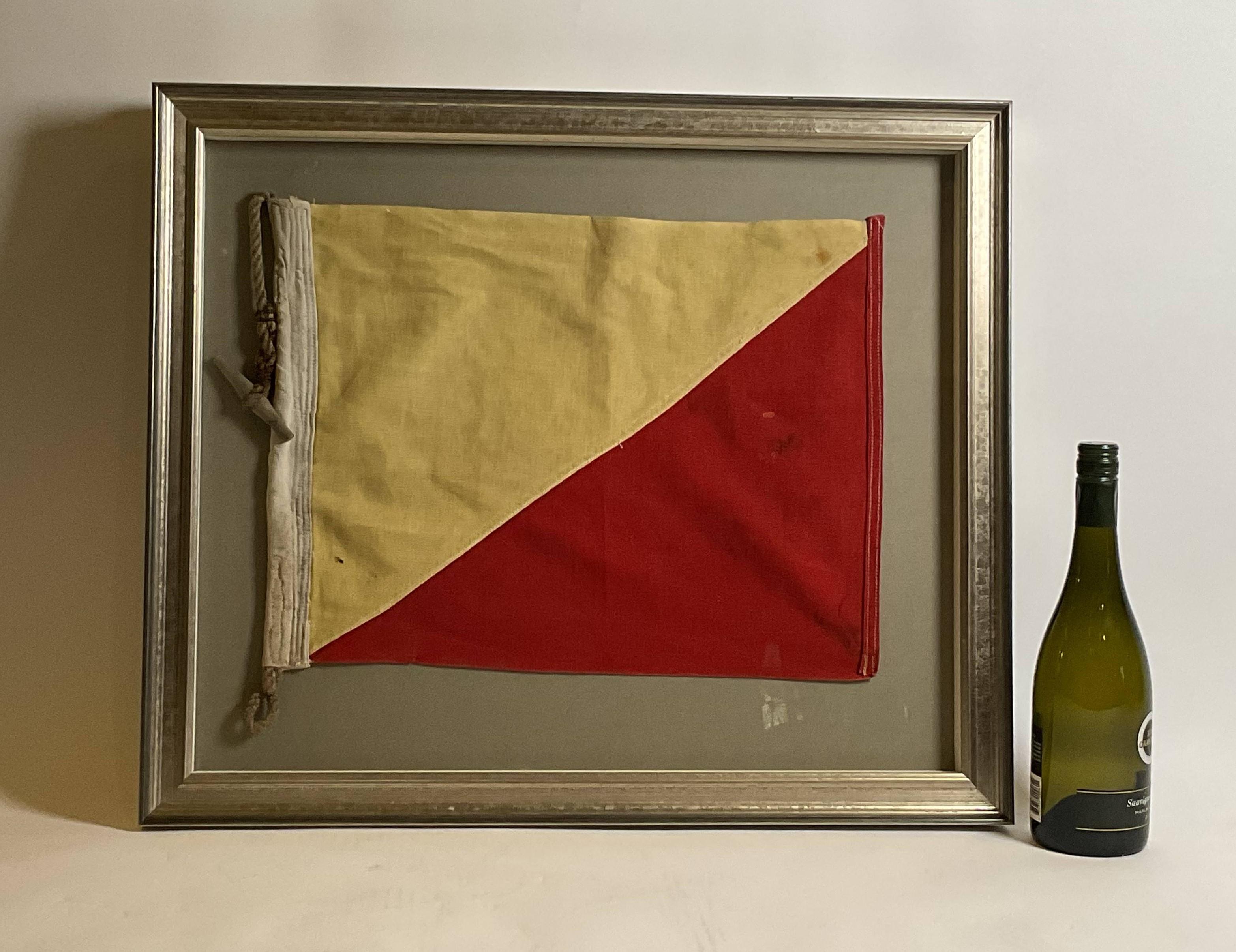 Maritime signal flag representing the letter “O”, oscar. The flag has red and yellow stitched panels with canvas hoist. Manila rope and wood toggle. Shadow box frame.

Weight: 8 lbs.
Overall Dimensions: 22