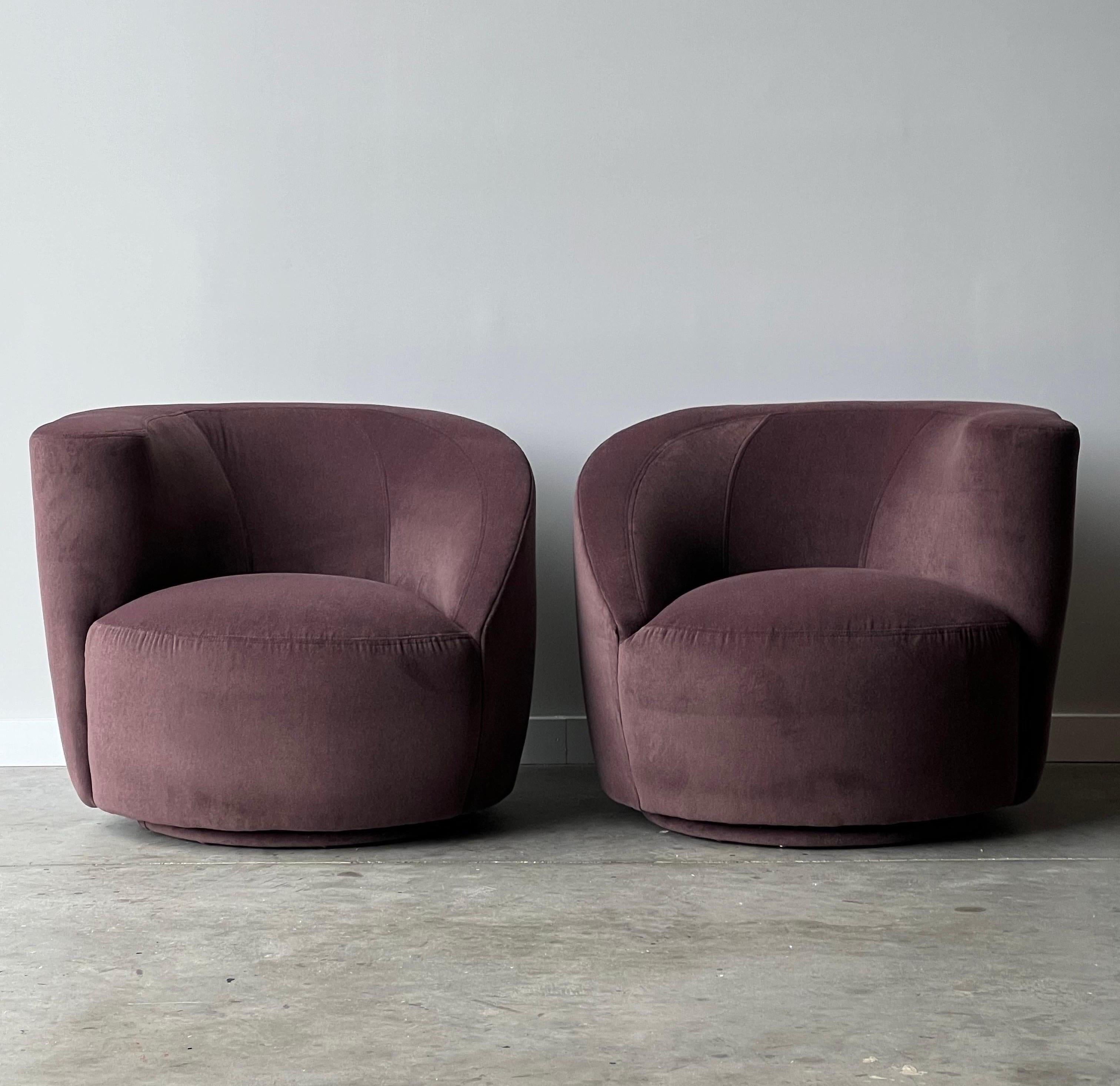 Vintage pair of lounges designed by Vladimir Kagan. This design by Kagan is coined the Nautilus Lounge. The pair sit on swivel bases that rotate with ease. Perfect for a room with panoramic views. They are both sculptural and extremely comfortable.