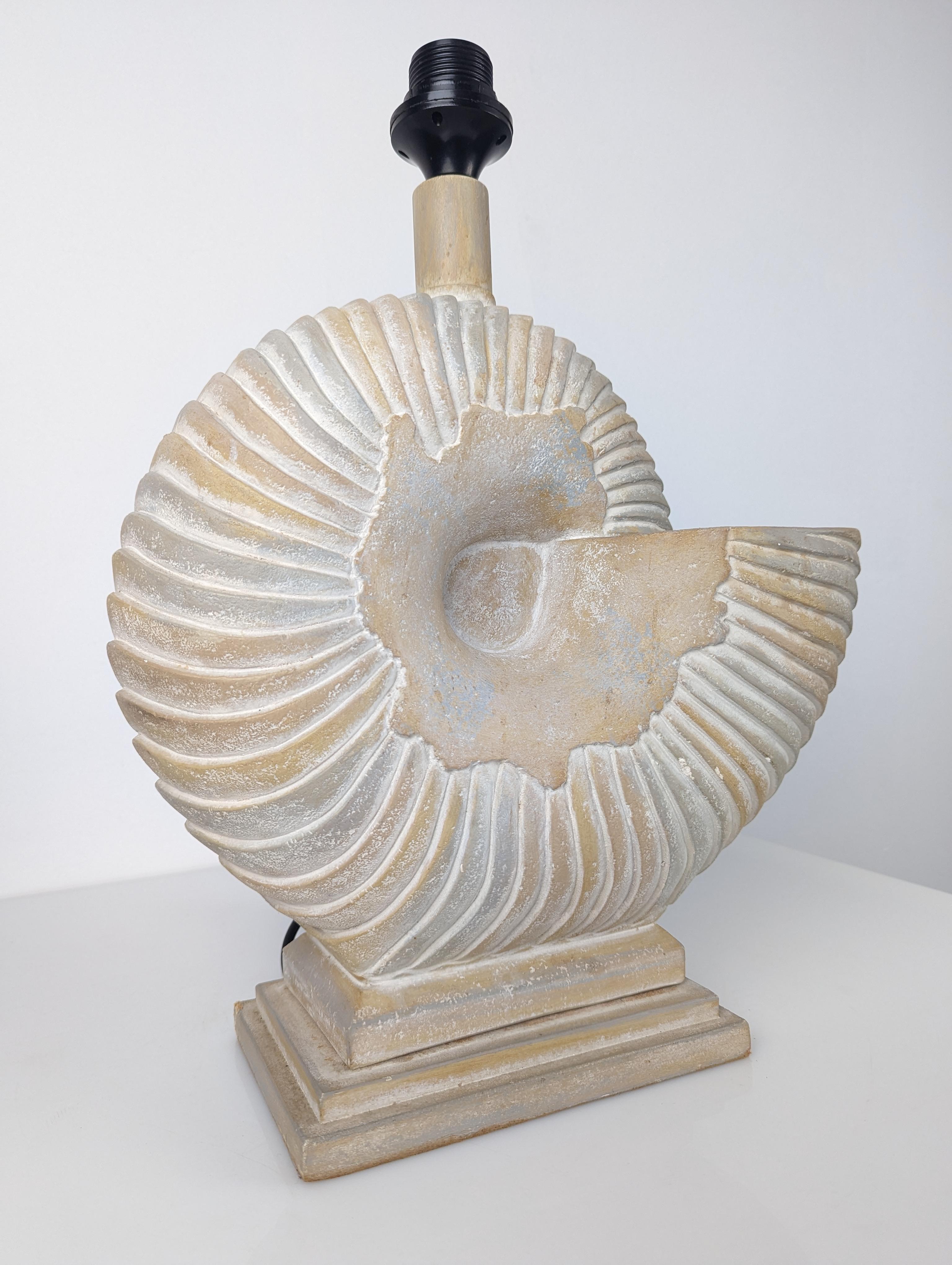 Large vintage lamp representing a large Nautilus shell made of stucco, sealed on one edge and dated 1983.