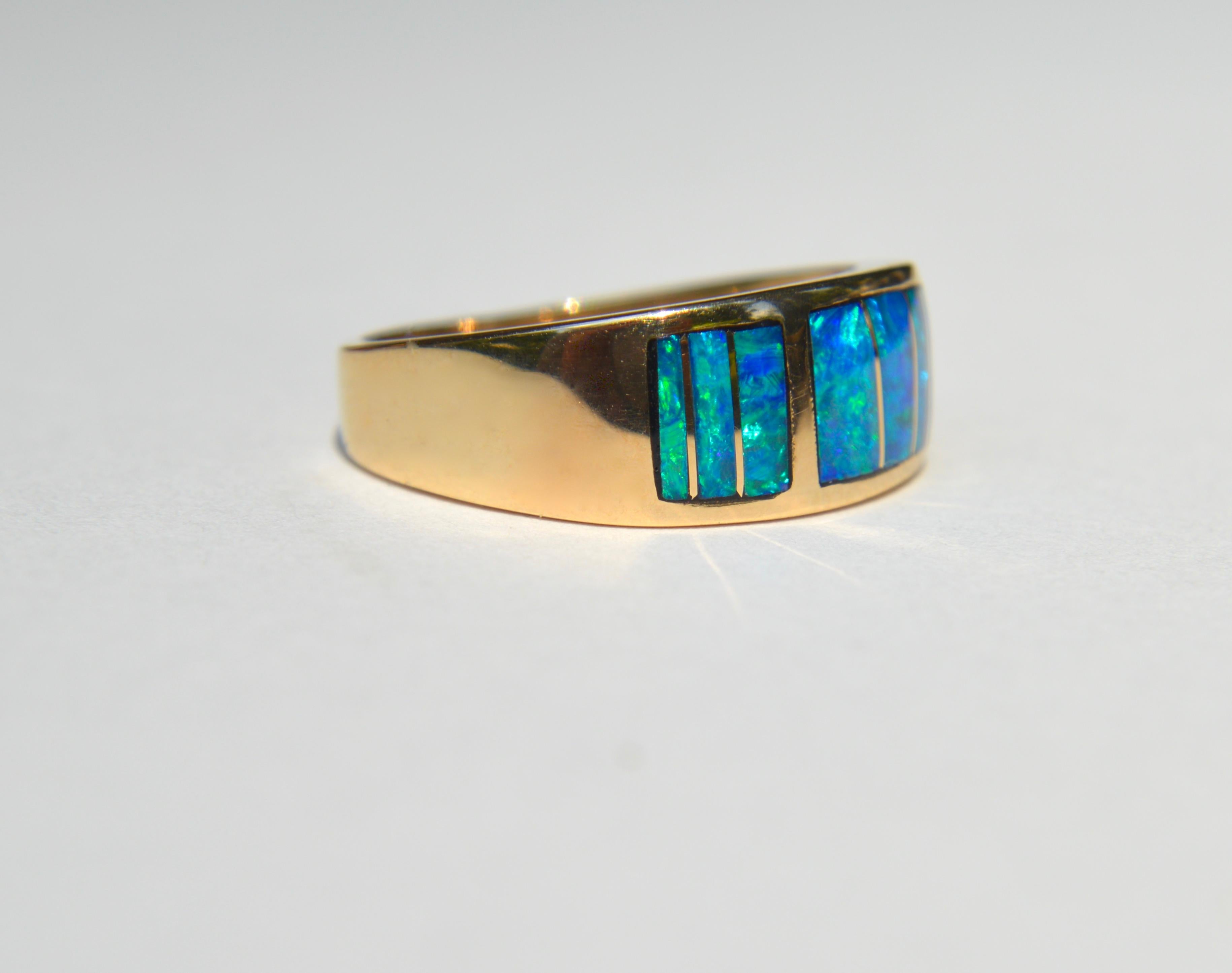 

Vintage deadstock unworn Navajo c1970s 14K yellow gold black boulder opal inlay band. Size 7.5, resizing not recommended. Marked as USA 14K, maker /artist T.D. In excellent unworn condition. Widest point measures 8mm. Ring weighs 4.98 grams.

Opal