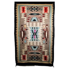 Vintage Native American Navajo Rug in a Storm Warrior Design in turquoise, Pink