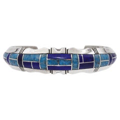 Bracciale d'epoca Navajo Gilbert Nelson in argento sterling con intarsio di più pietre