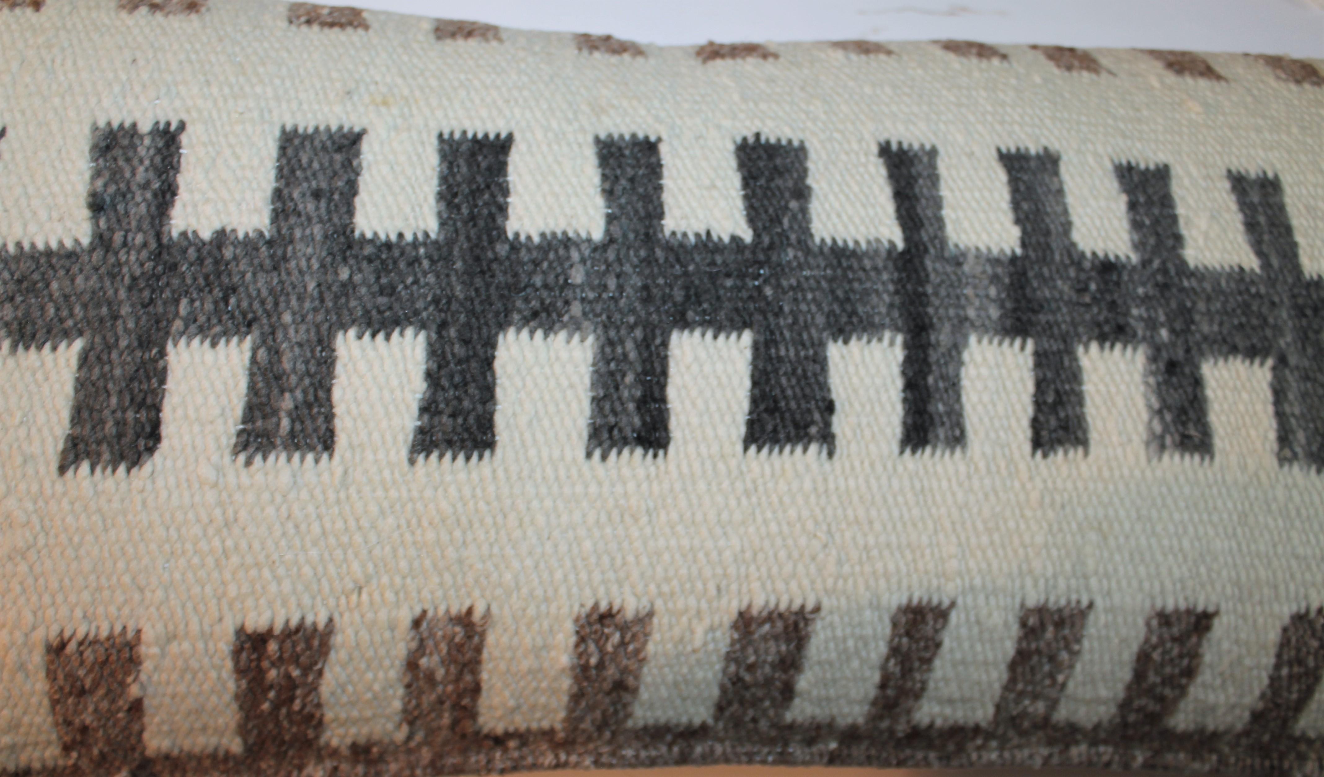 Antique Navajo Indian weaving bolster pillow with pig skin backing. The insert is down and feather fill.