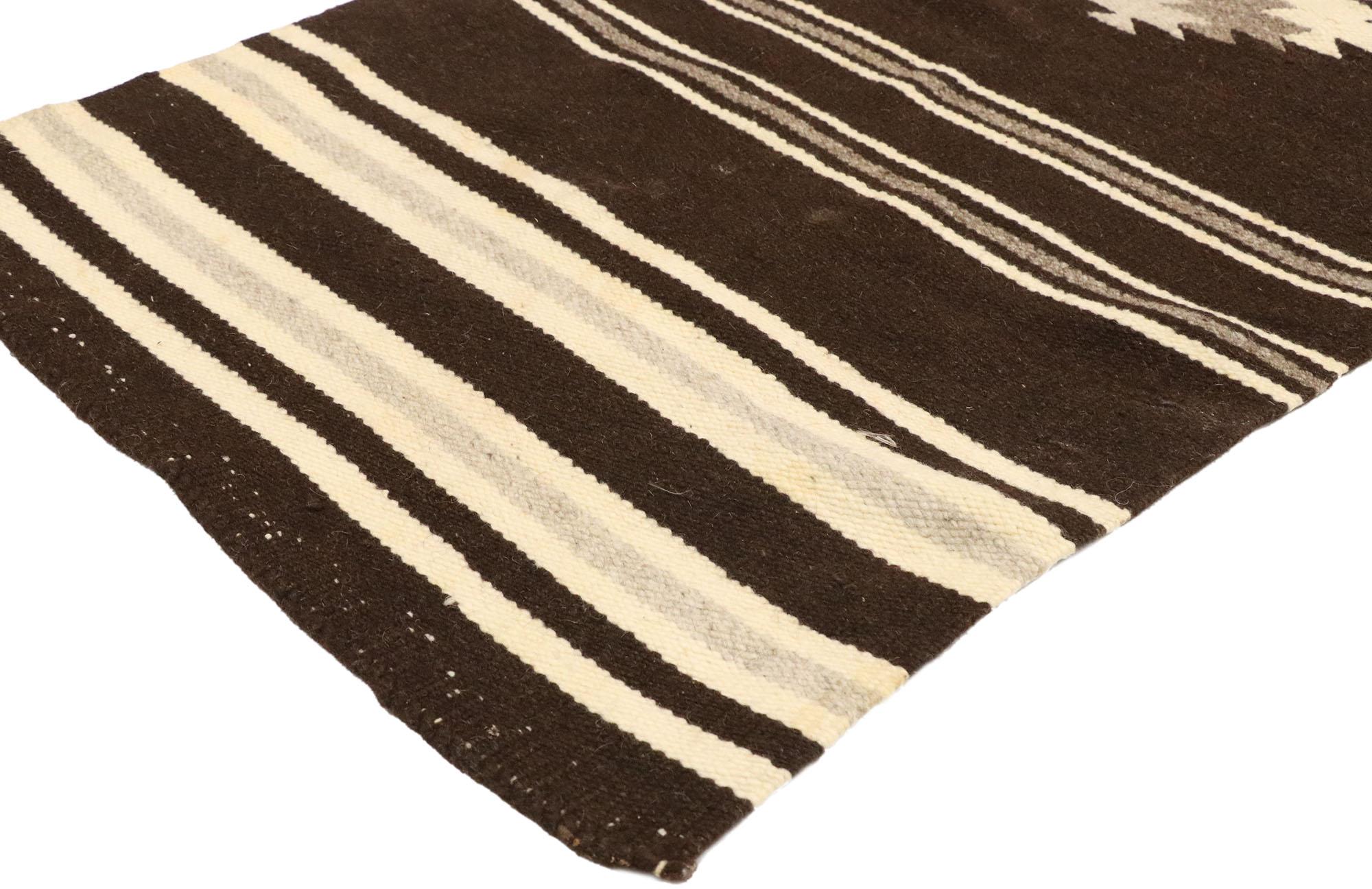 77484 vintage Navajo Kilim Rug with Native American style and two grey hills vibes. With its bold expressive design, incredible detail and texture, this handwoven wool vintage Navajo Kilim rug is a captivating vision of woven beauty highlighting