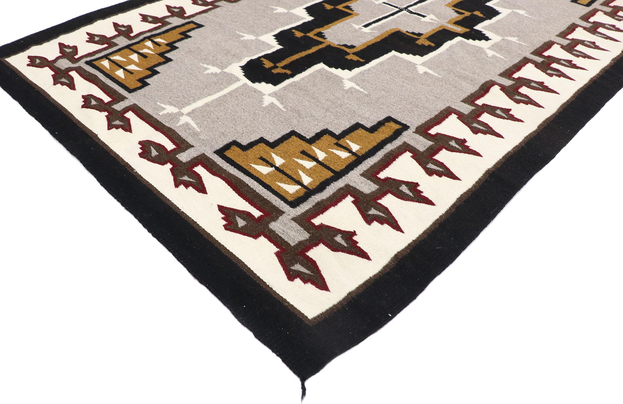 77770 vintage Navajo Kilim rug with two grey hills style 04'06 x 07'02. With its bold expressive design, incredible detail and texture, this hand-woven wool vintage Navajo Kilim rug is a captivating vision of woven beauty highlighting Native