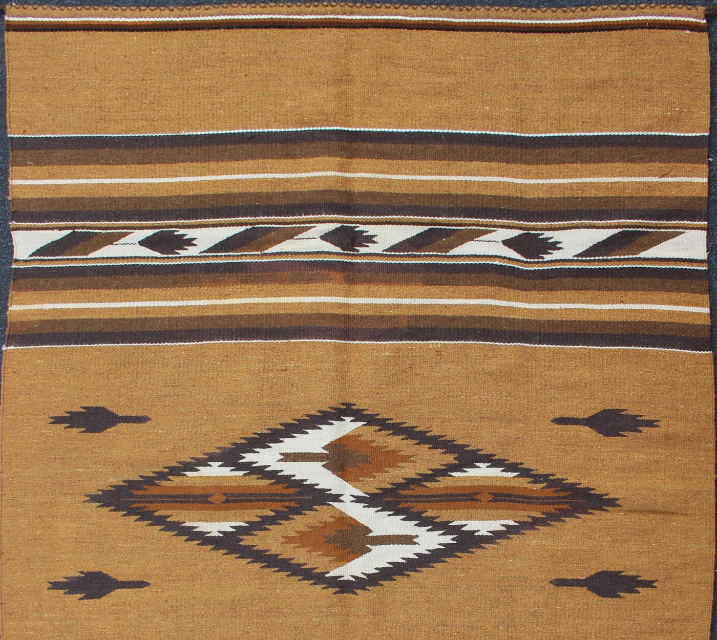 1930s American Navajo Kilim with geometric design in Marigold, brown, and ivory rug 1912-1511, country of origin / type: America / Navajo, circa 1930

This intriguing antique Navajo Kilim, circa 1930 was woven in the United States during the first