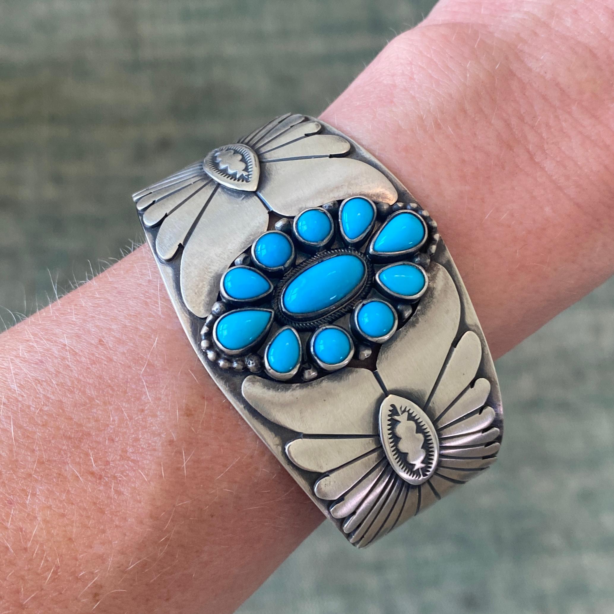 Vintage Navajo Mark Yazzie Sleeping Beauty Turquoise Sterling Silver Cuff
Beautiful Silver patina with layers of silver on silver around the cuff bracelet.  Bright , smooth, blue turquoise shine on the very front.
Size Medium for women, small for