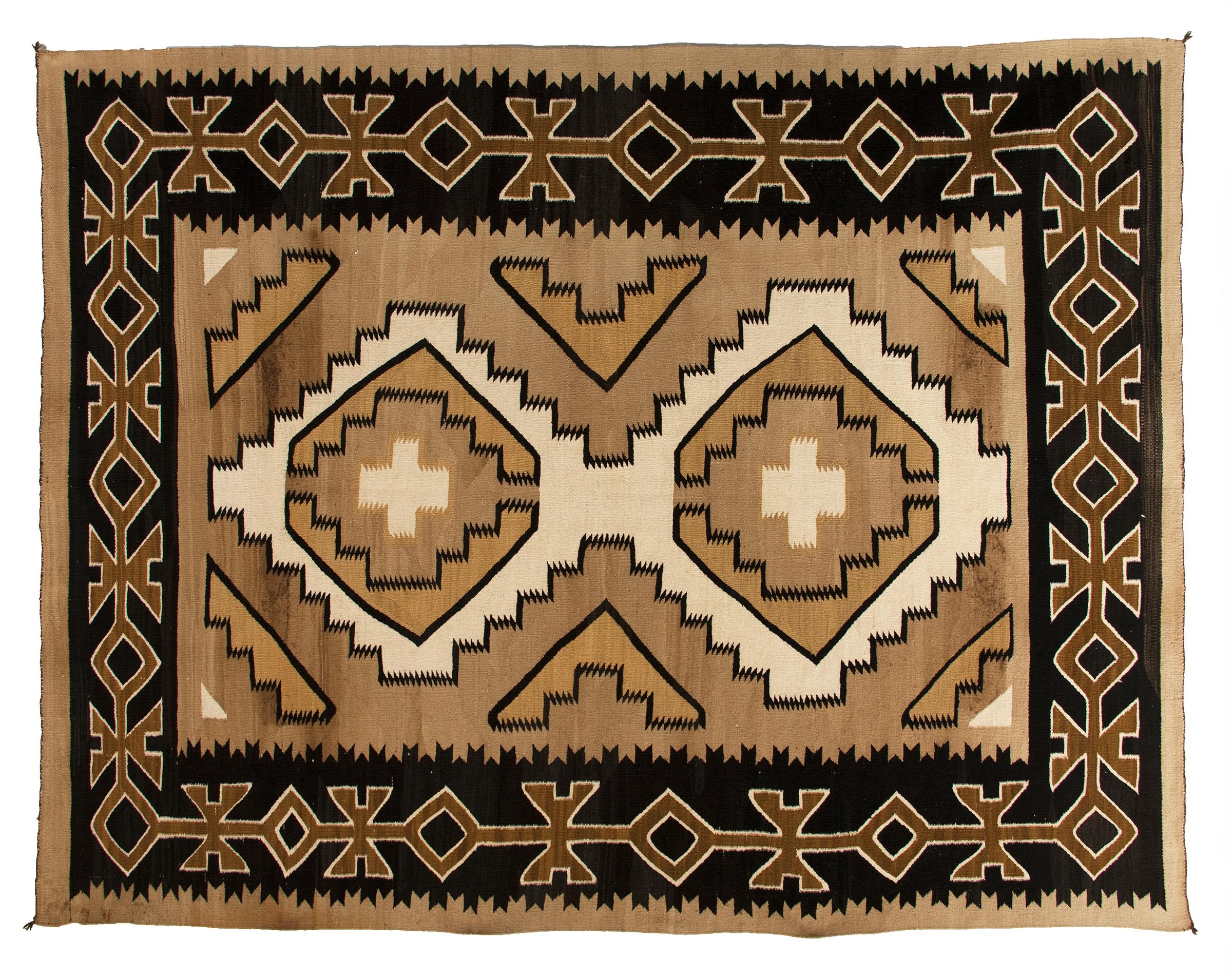 Vintage antique Navajo rug from the crystal trading post, crystal, New Mexico, circa 1930s-1950s. Handwoven by a Navajo weaver of native hand-spun wool in natural fleece colors of black, brown, camel and ivory. This textile is well suited for use on