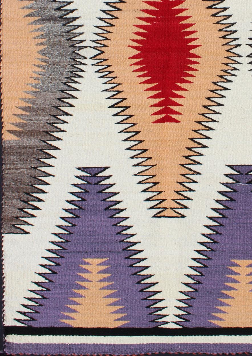 American antique Navajo rug with geometric design in red, peach, grey, lavender, white and black, rug EBD-1010, country of origin / type: America / Navajo, circa 1940.


Measures: 2'6 x 4'9.

