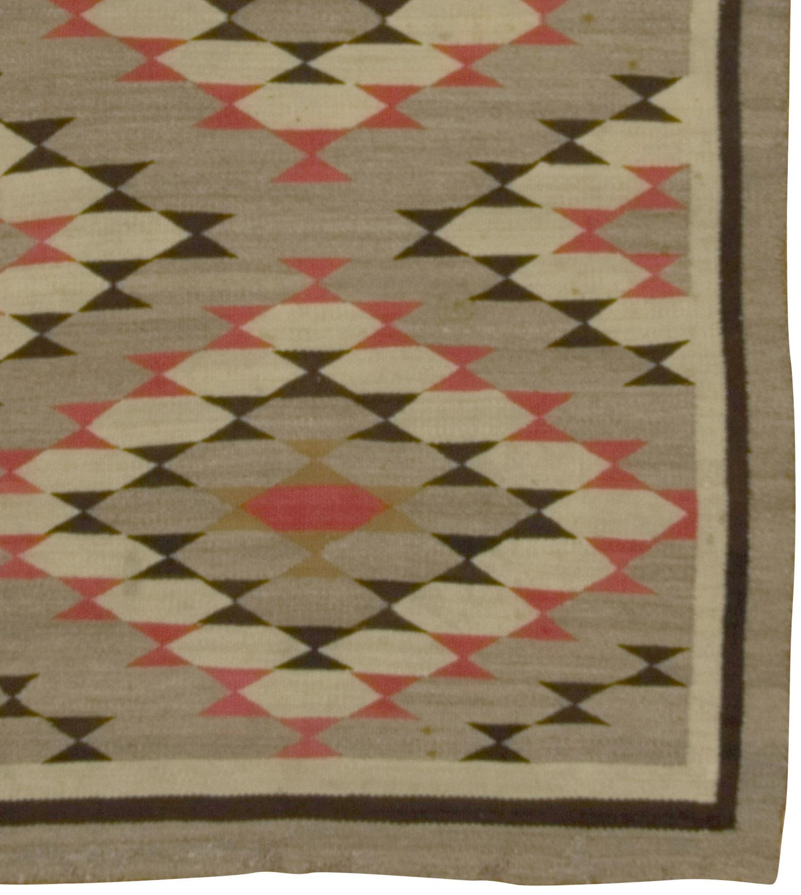 Vintage Navajo rug Kilim, circa 1940, 3'7 x 4'10. Although not attributable to a specific weaving site and too late for an eye dazzler this attractive rustic weaving beguiles with the pattern of saw tooth diamonds on the naturally abrashed gray
