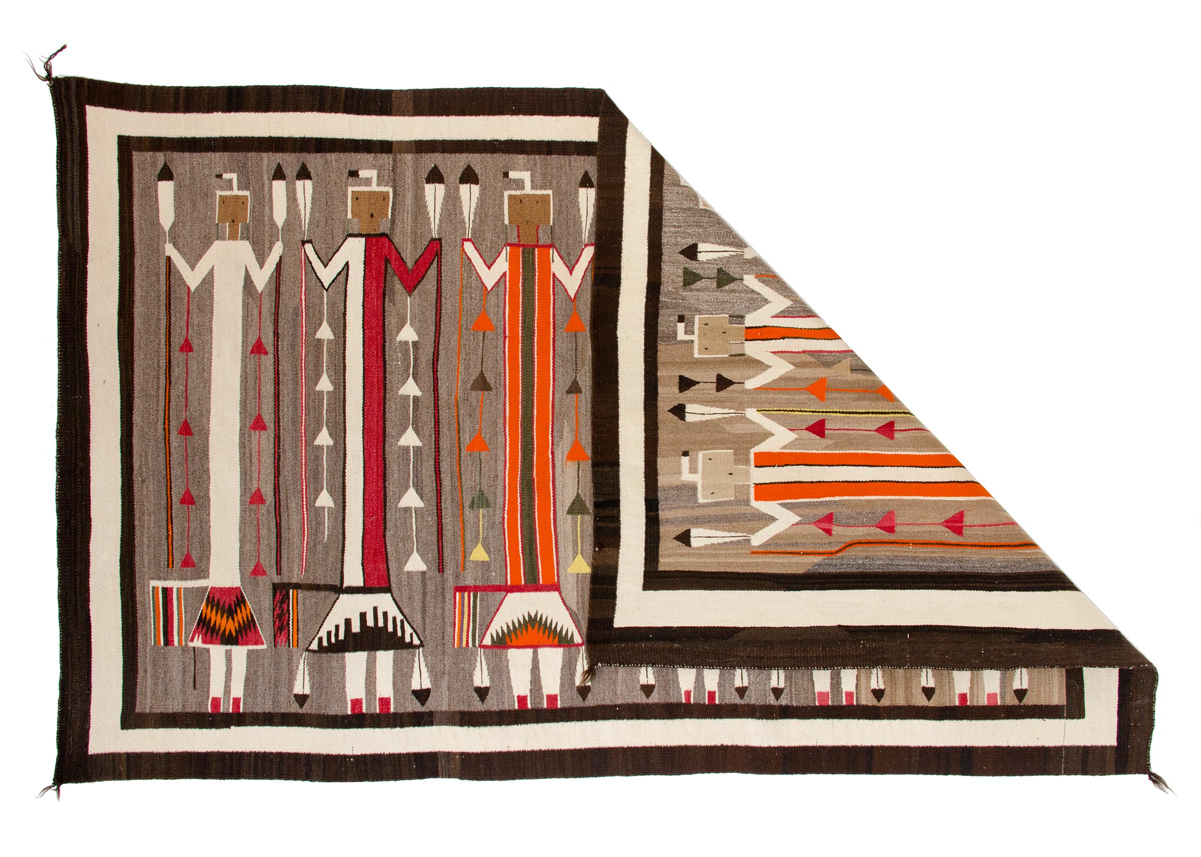 Vintage Navajo rug, circa 1920s-1930s, Pictorial Weaving with six Yei (Yeibichai) figures holding feathers. Woven of native hand-spun wool in natural fleece yarns in gray, ivory/white and brown with aniline-dyed yellow, red, orange/tan, (known as
