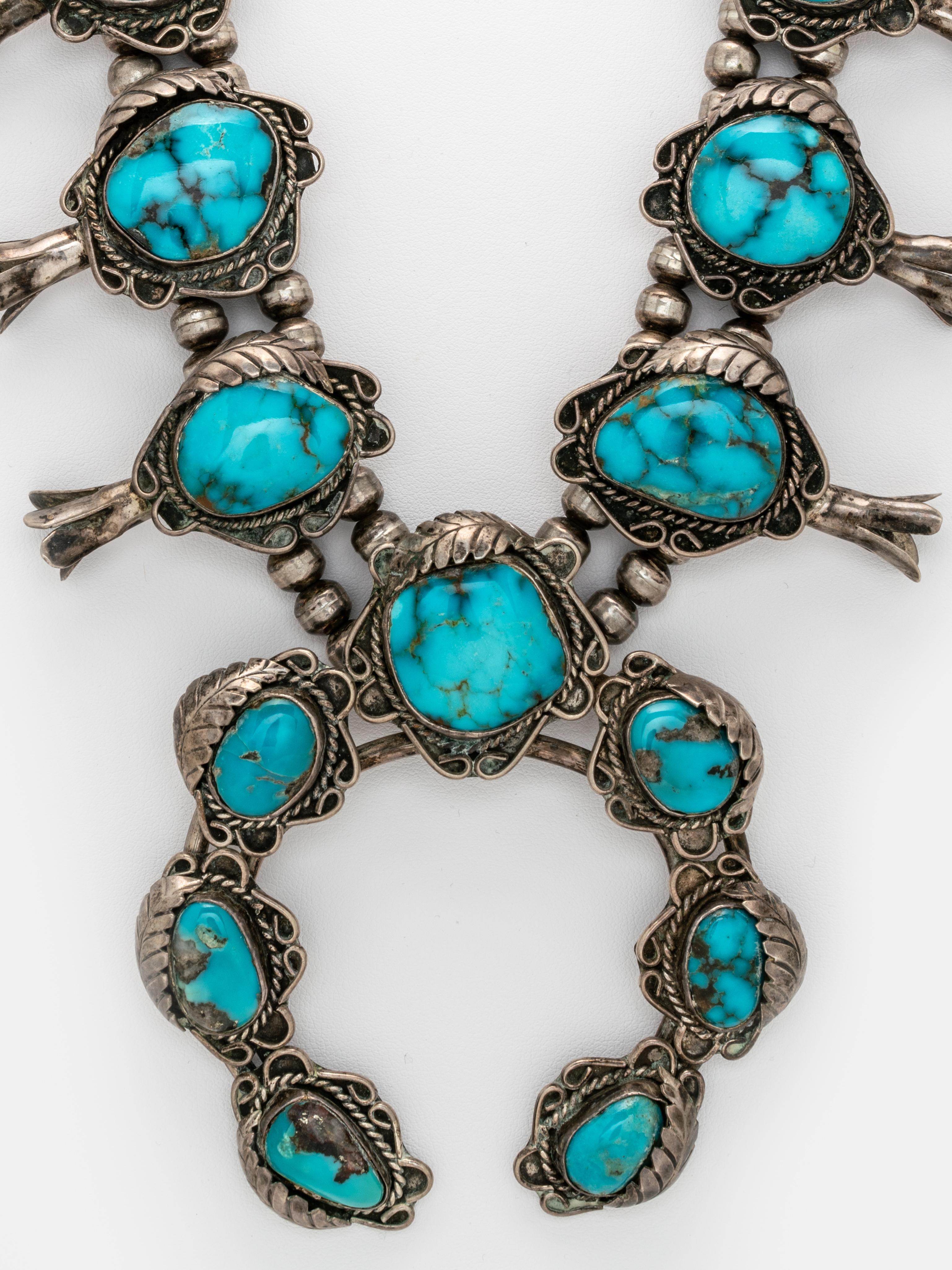 Amazing Vintage Navajo Silver and Kingman Turquoise Squash Blossom Necklace c.1970s
209 Grams
Length: 66 cm