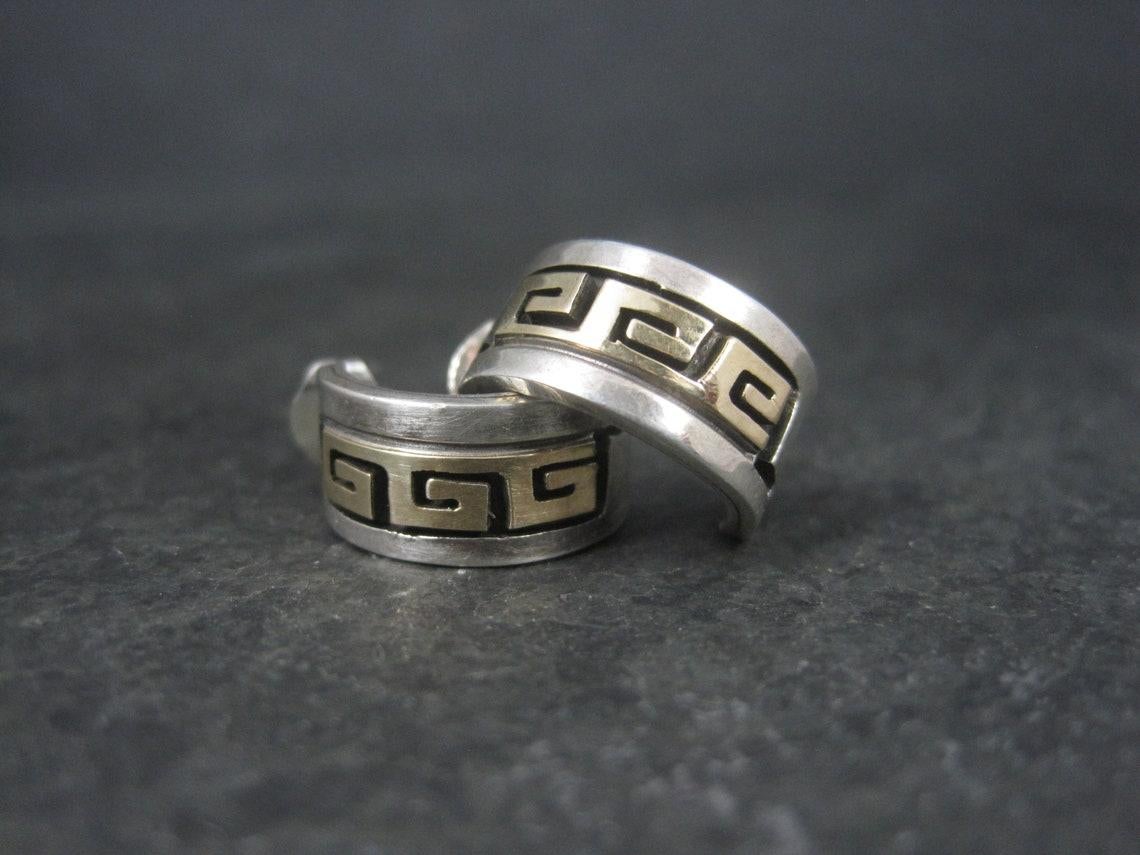 These beautiful vintage earrings are a combination of 14k gold and sterling silver.
They are the creation of Navajo silversmith Rhoda Jack.

Measurements: 1/4 by 5/8 of an inch
Weight: 5.3 grams

Marks: Sterling, 14K, Rhoda's Bear, Bear track
