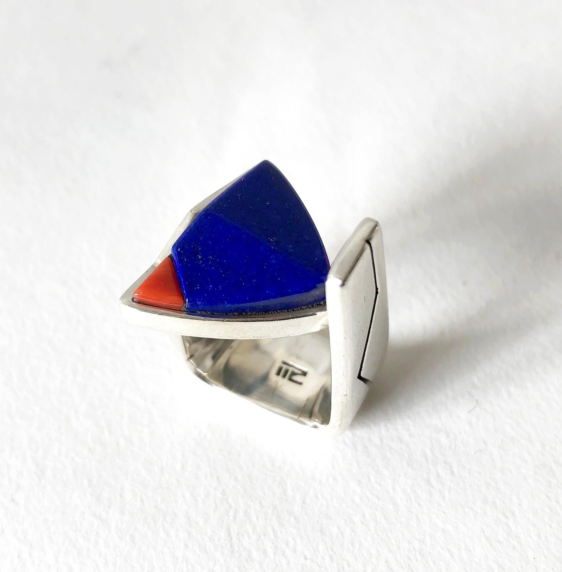 Vintage 1990's sterling silver ring with lapis lazuli and coral inlay by Richard Chavez.  Ring is a finger size 4 or so and is signed with a stylized 