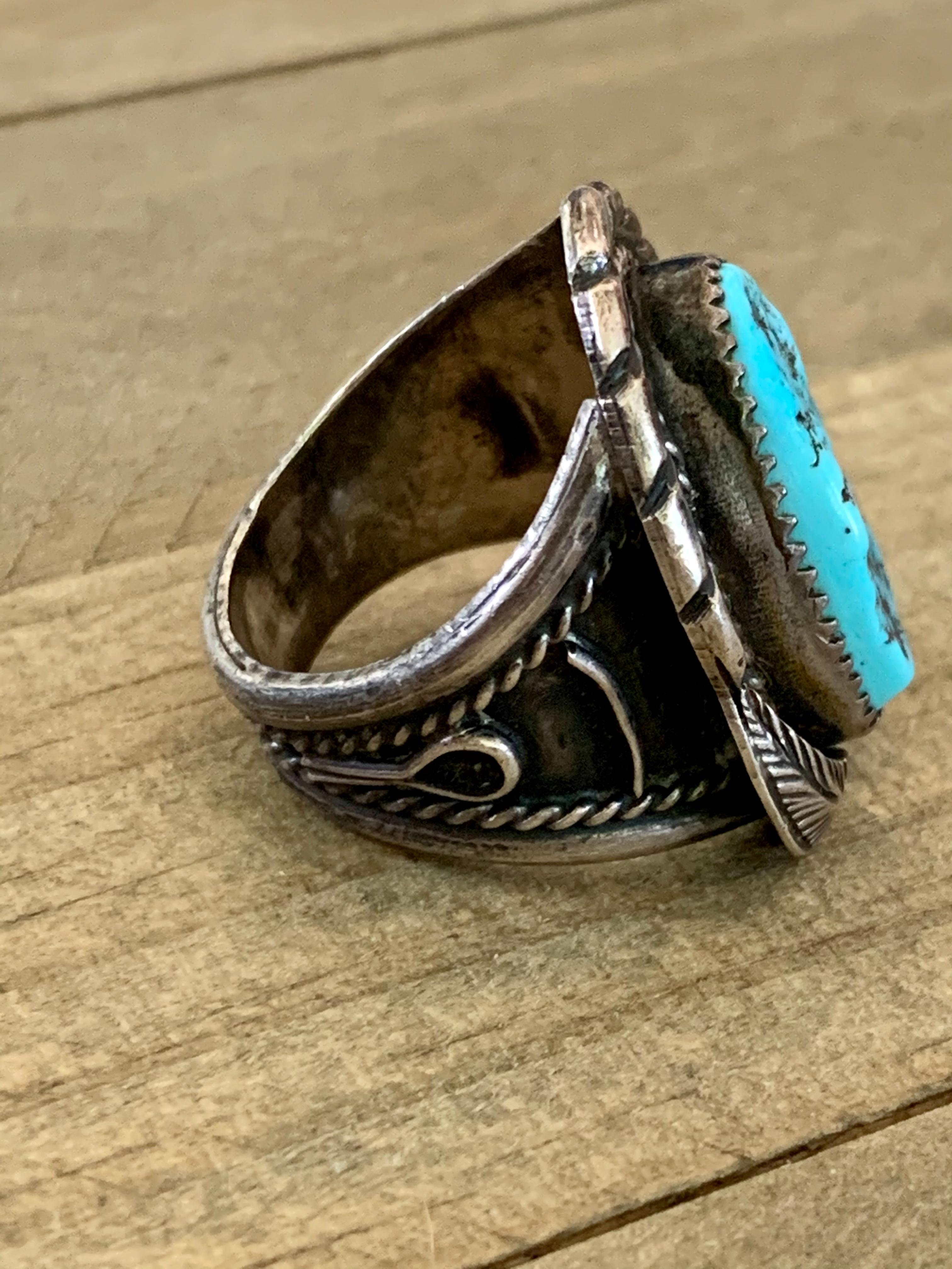This vintage Navajo Sterling Silver ring features a brilliant blue Turquoise stone.

The ring measures 1-1/8