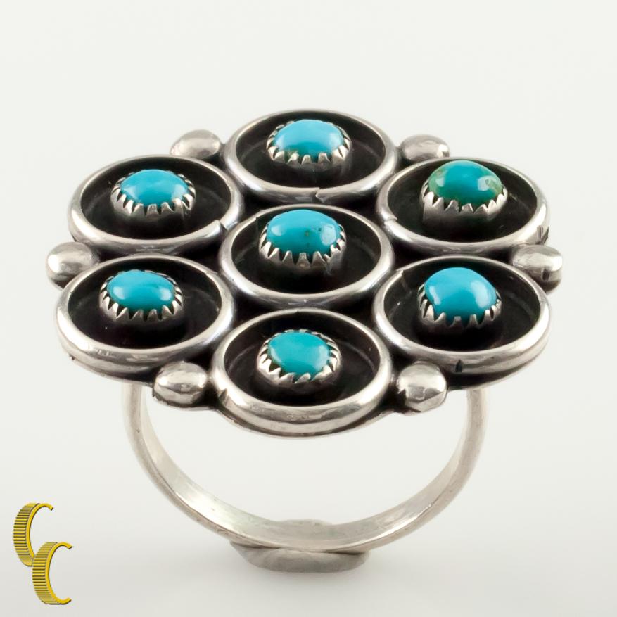 Gorgeous silver and turquoise Native American Navajo ring.
Features a plaque set with tangent circles set with bezel-set round turquoise.
Size: 7.5.
Metal: 0.925 sterling silver.
Weight: 7.2 grams.