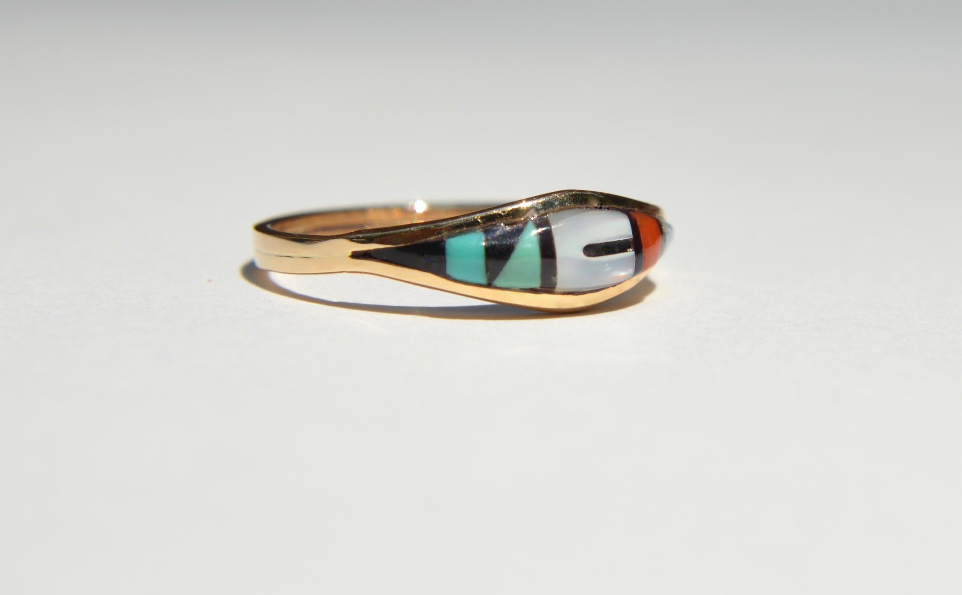 Vintage c1980s 14K yellow gold deadstock Navajo inlay band with onyx, turquoise, red coral and mother of pearl. Size 7.25, cannot be resized. In excellent, unworn condition. Ring weighs 1.64 grams. Marked and tested as 14K gold.

All items arrive in
