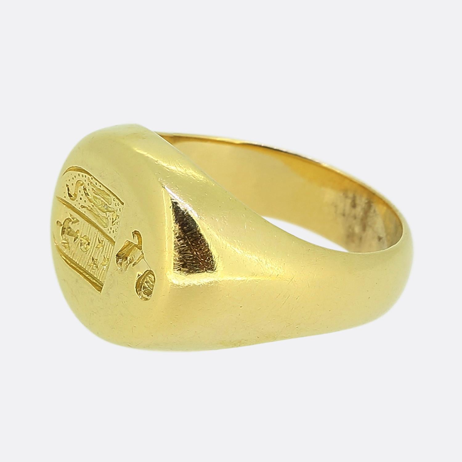 Here we have a distinguished oval shaped signet ring crafted from a rich 18ct yellow gold. This vintage showcases a deep intaglio at the face, featuring detailed engravings including an anchor, stars and sea creature; all within a single emblem. The