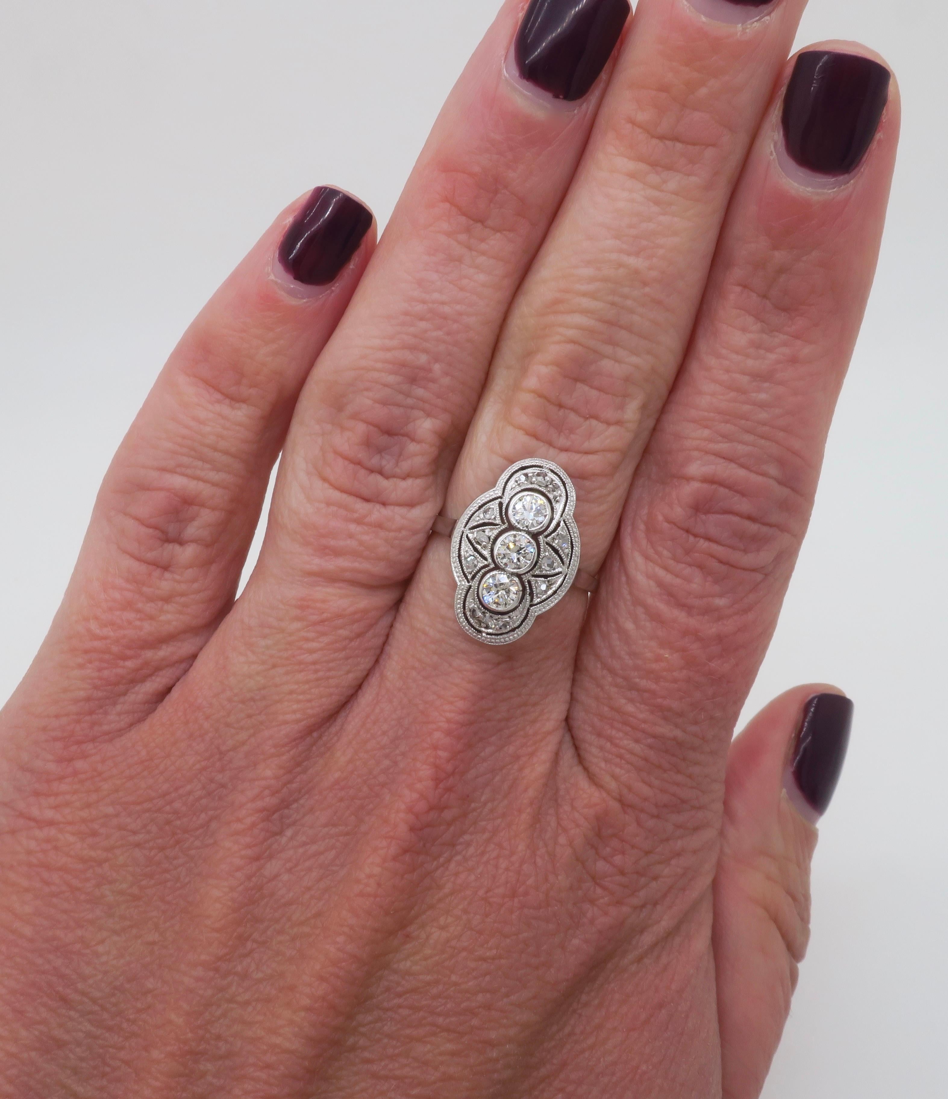 Vintage navette style diamond ring crafted in 14k white gold. 

Diamond Carat Weight: .65ctw Earth Mined Diamonds 
Diamond Cut: Transitional Round & Rough Cut 
Color: E-G
Clarity: VS1-VS2
Metal: 14K white gold
Marked: Stamped 