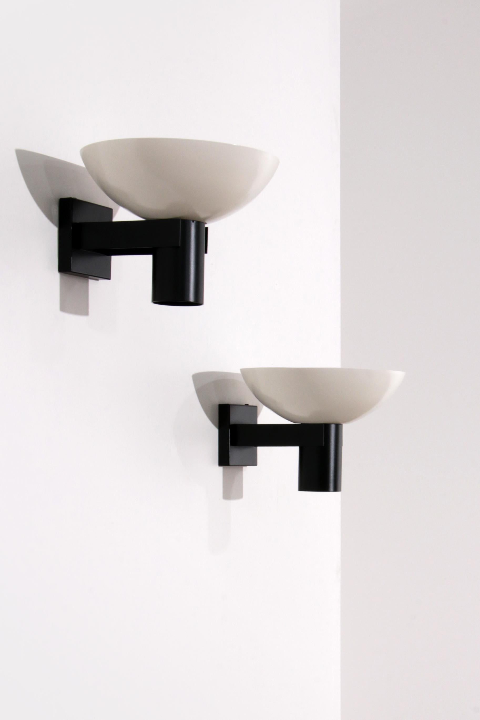 Enhance your living space with the timeless elegance of the Vintage ND60D Wall Lamp by Louis Kalff for Philips, crafted in the 1960s. This iconic wall lamp features dual light sources, providing illumination from both the top and bottom. The unique