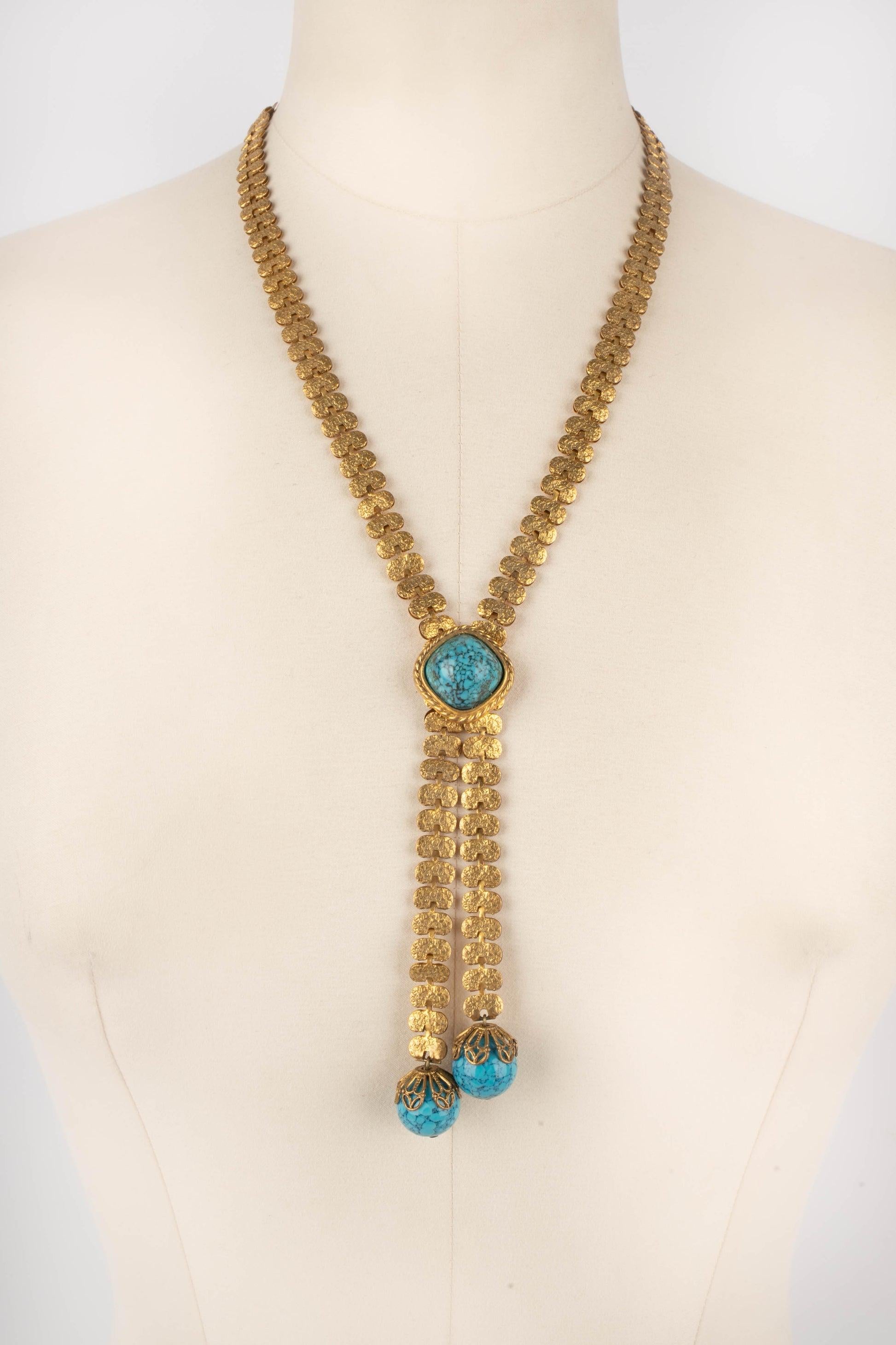 Collana in metallo dorato con perle blu.

Informazioni aggiuntive:
Condizioni: Ottime condizioni
Dimensioni: Lunghezza: 52 cm

Riferimento del venditore: BC156