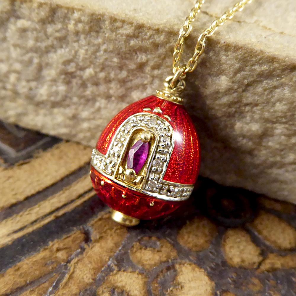 This lovely Vintage egg pendant is crafted from unmarked 18ct Yellow Gold adorned with both a Ruby and very small Diamonds giving it that extra special touch. With a beautiful red Enamel shell it sparkles and glimmers from every angle. Topping off