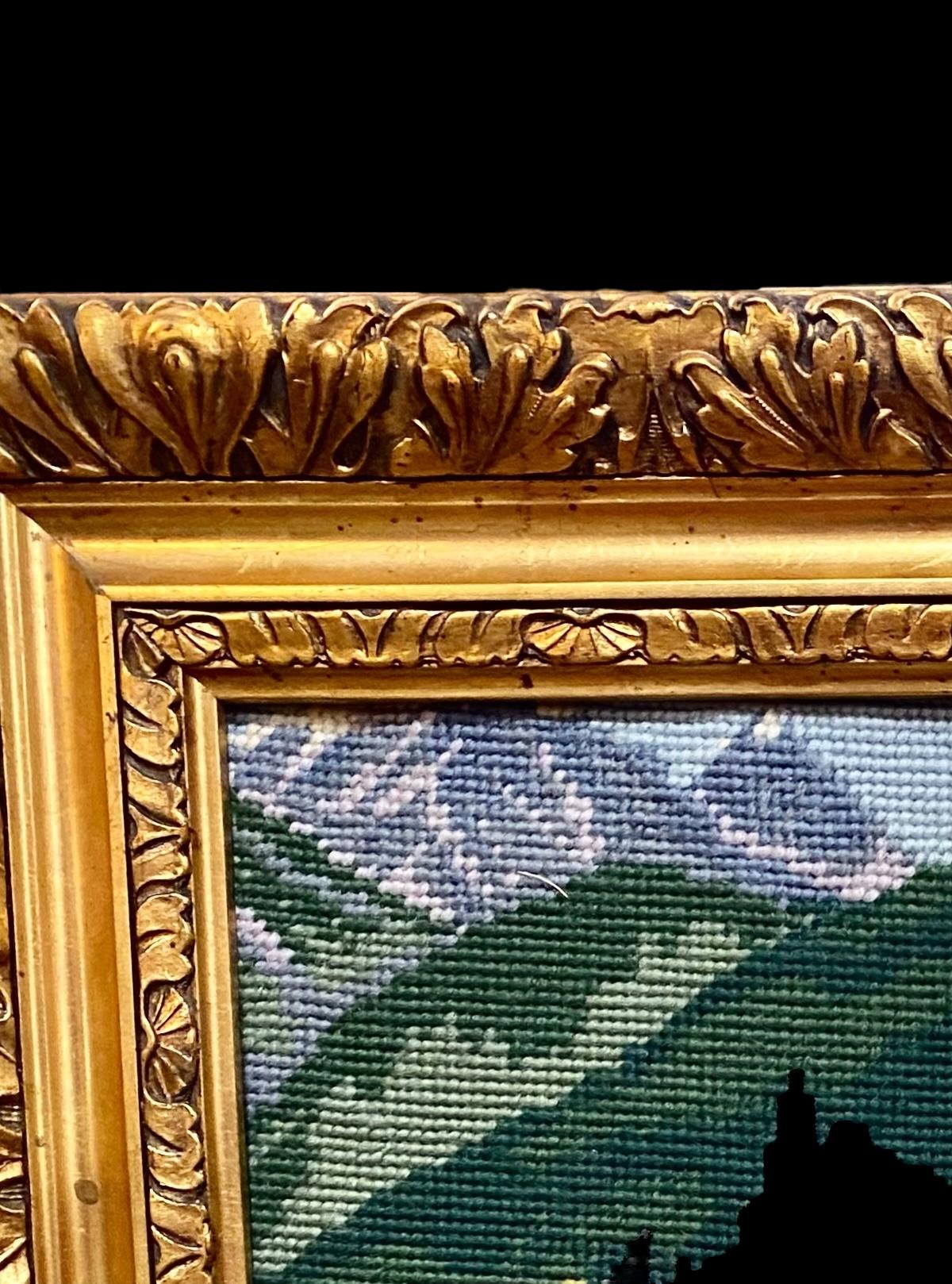 A vintage hand done needlepoint of Neuschwanstein Castle, Bavaria, Germany, presented In a regal hand carved gilt wood frame.

Neuschwanstein Castle was built in the 1800s and is located in Germany. The castle is said to be the inspiration for
