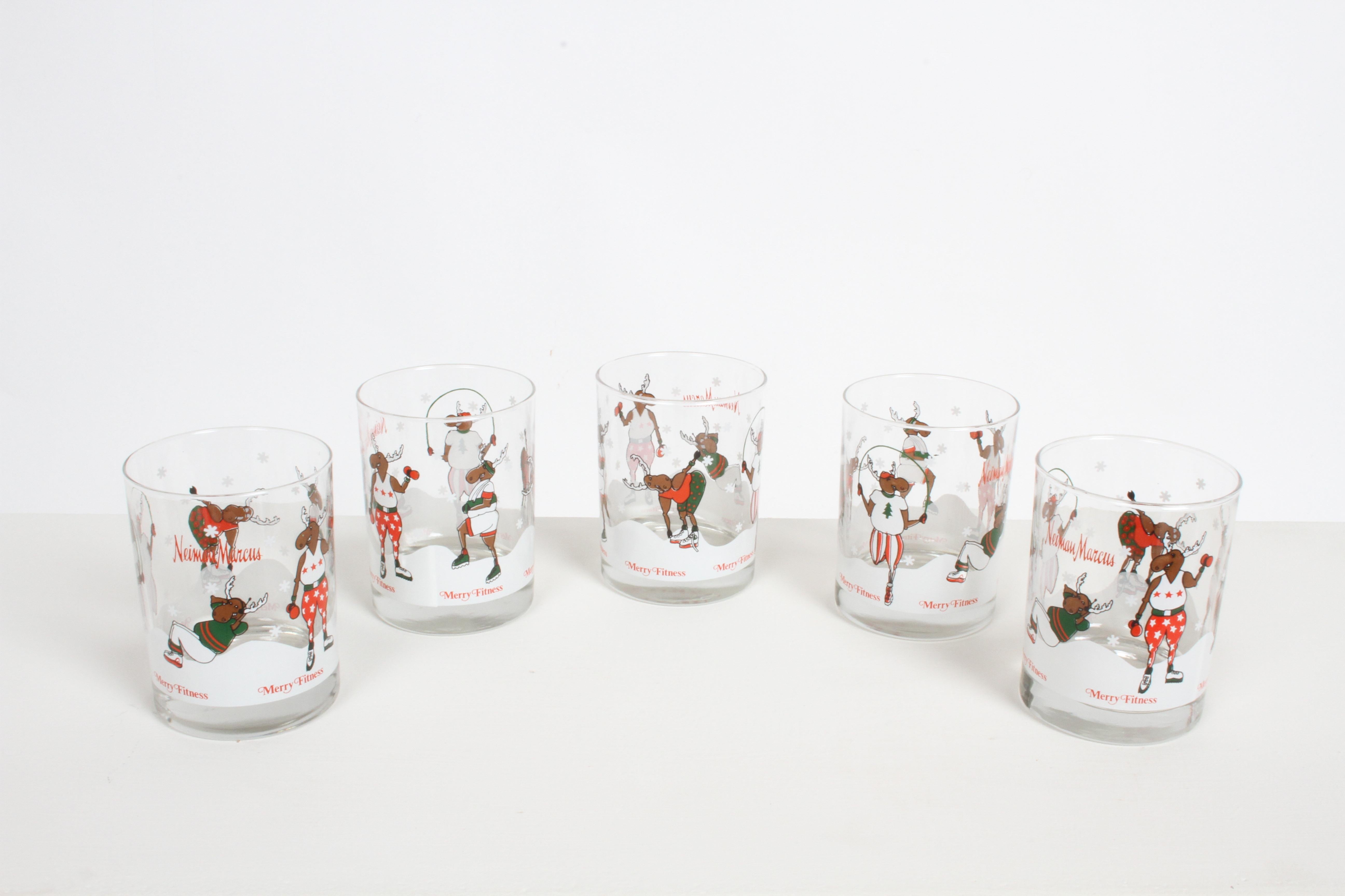 Vintage 1980s barware by Neiman Marcus, this set of five rock glasses with Holiday fitness theme of reindeer's working out, by jogging, stretching, jumping rope, lifting weights and sit ups. They appear to never have been used or very little use. No