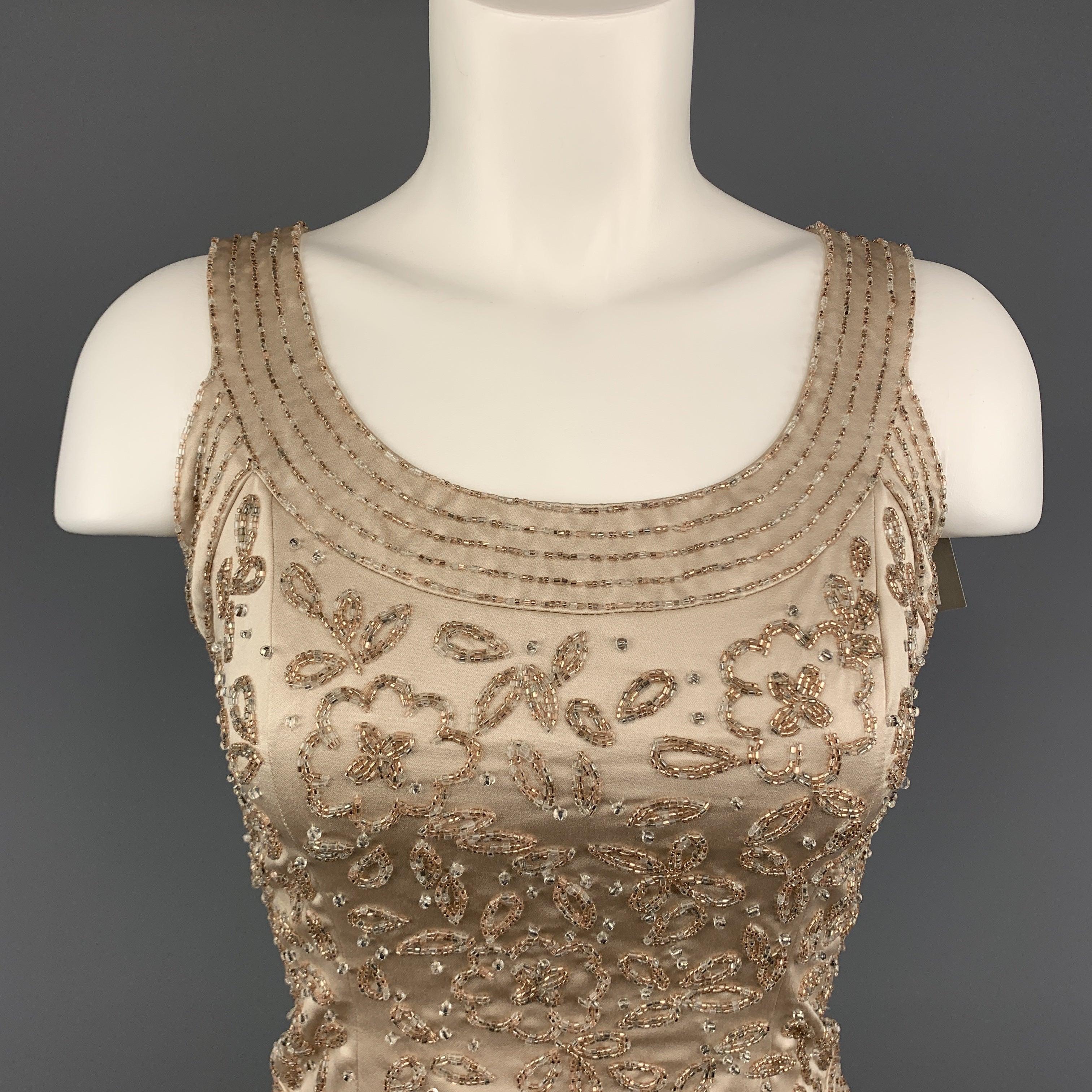 Vintage NEIMAN MARCUS shell bustier top comes in beige satin with a scoop neckline back zip closure, and beaded floral motif. Excellent Pre-Owned Condition. 

Marked:   2 P 

Measurements: 
 
Shoulder: 13 inches Bust: 34 inches Length: 17.5 inches 
