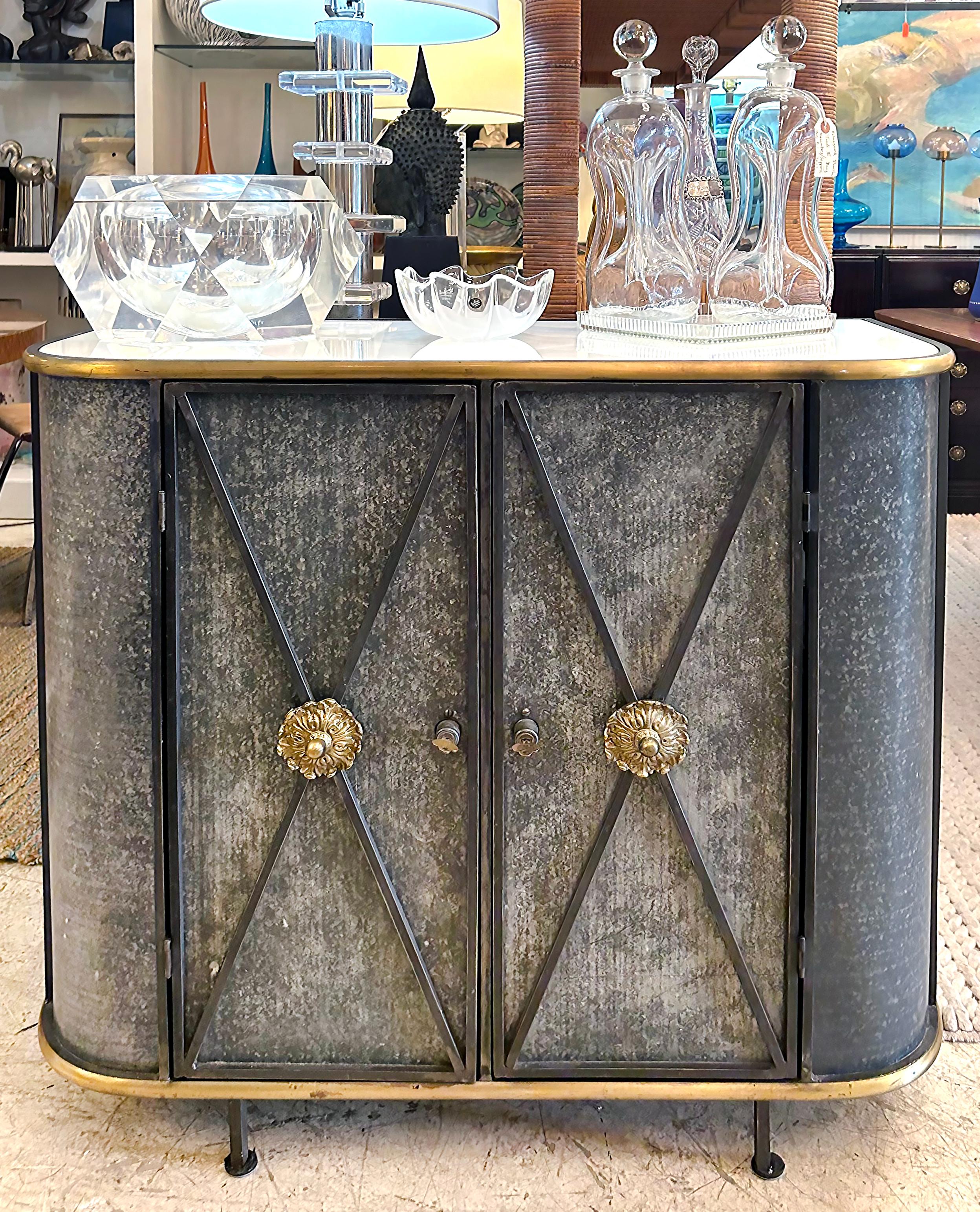 Vintage Neo-classical Iron, Brass, Metal 2-door Cabinet or Dry Bar, Glass Top 

Offered for sale is a Mid-20th century neo-classical style wrought iron, brass, and metal two-door cabinet with an inset milk glass top. The 2 doors open to reveal ample