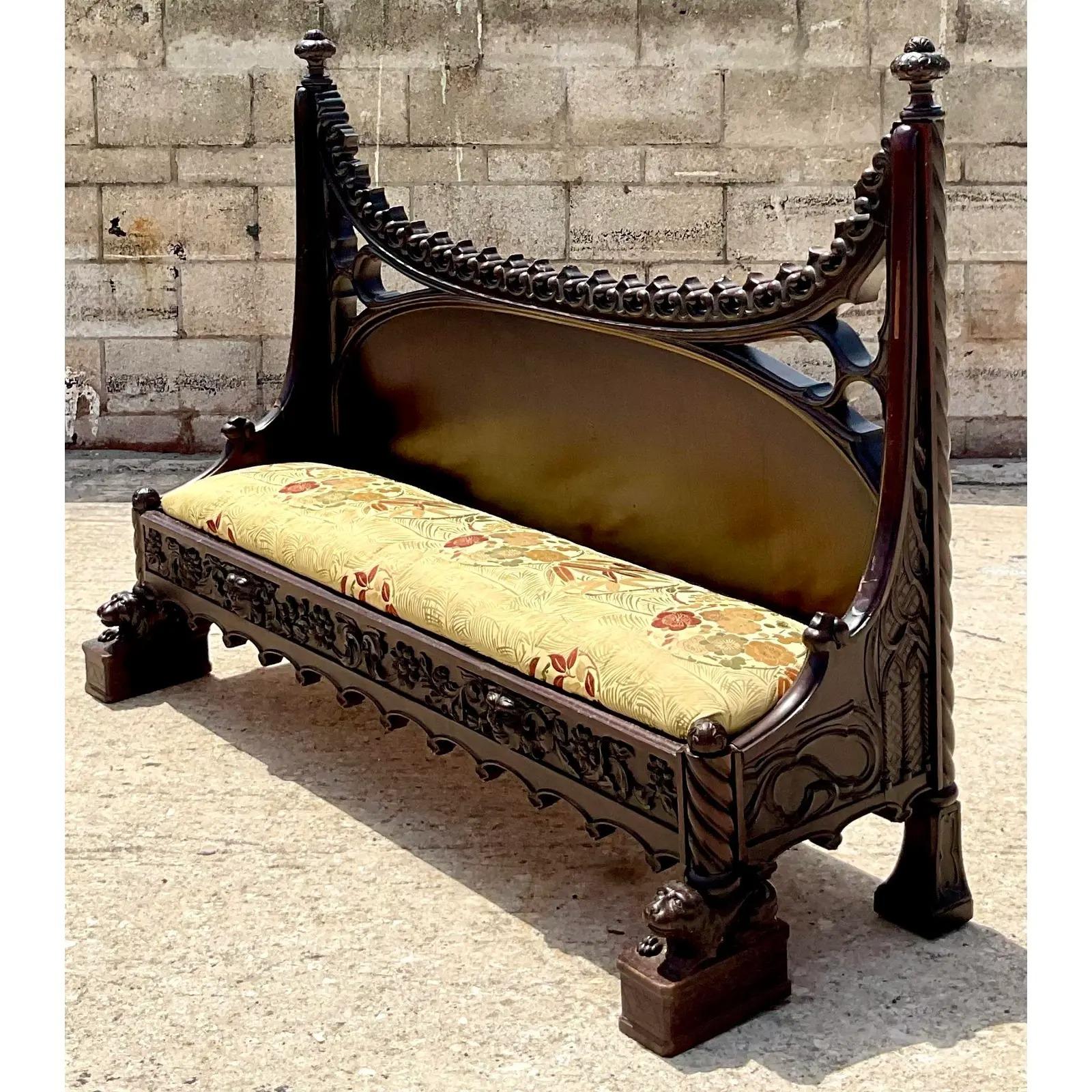 Incredible vintage Neo Gothic bench. Beautiful hand carved details and a striking shape. Acquired from a Palm Beach estate.