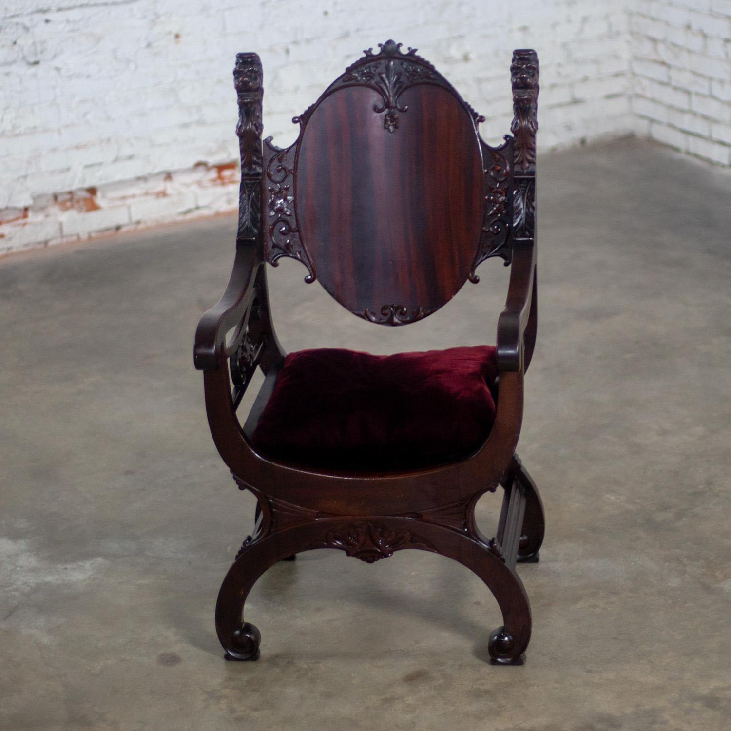 Stunning Late 19th Century Neo Renaissance Style lion head Savonarola Throne chair with a mahogany frame, carved details, & loose seat cushion with original velvety wine colored fabric. Beautiful condition, keeping in mind that this is vintage and