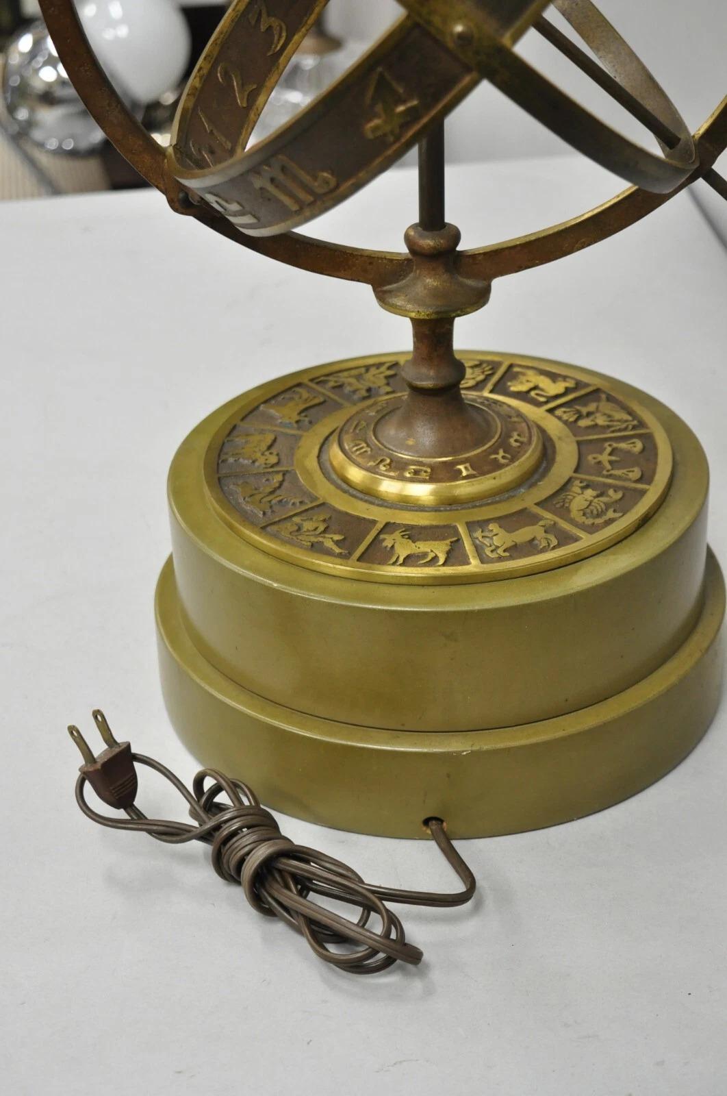 Vintage Neoclassical Style 3D Armillary Astrological Zodiac Patinated Bronze Table Lamp on Wooden Base. Circa Mid 20th Century. Measurements: 31