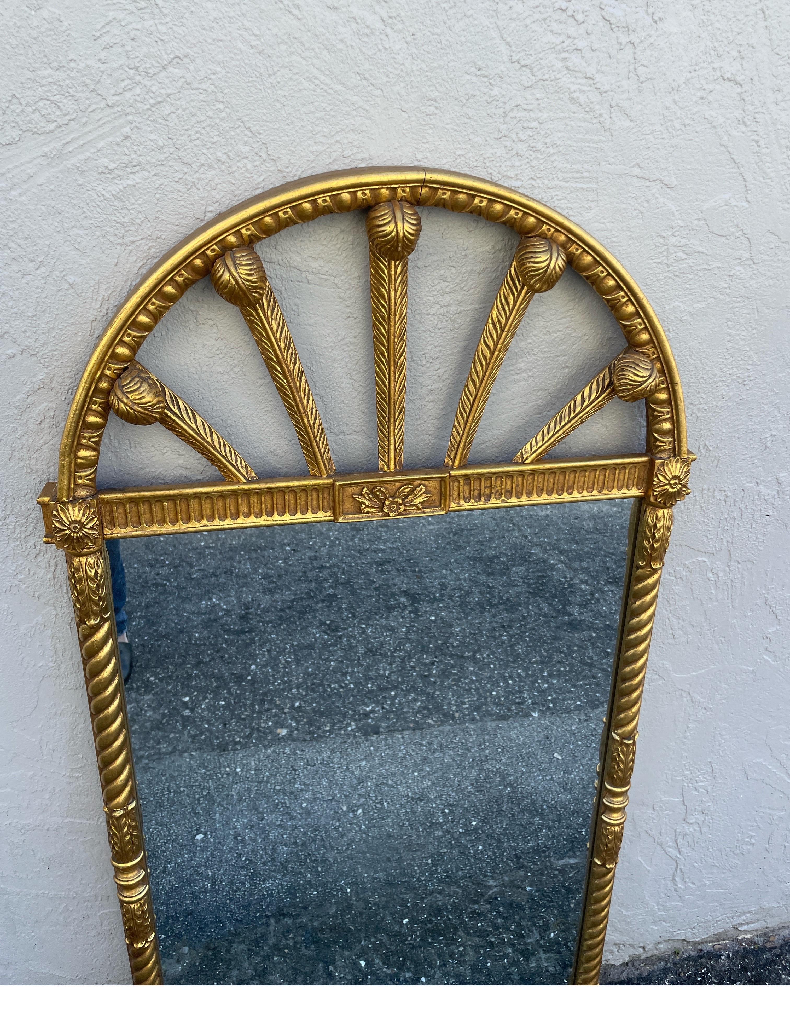 Large Arched Neoclassical Giltwood mirror. Finely detailed on all sides.