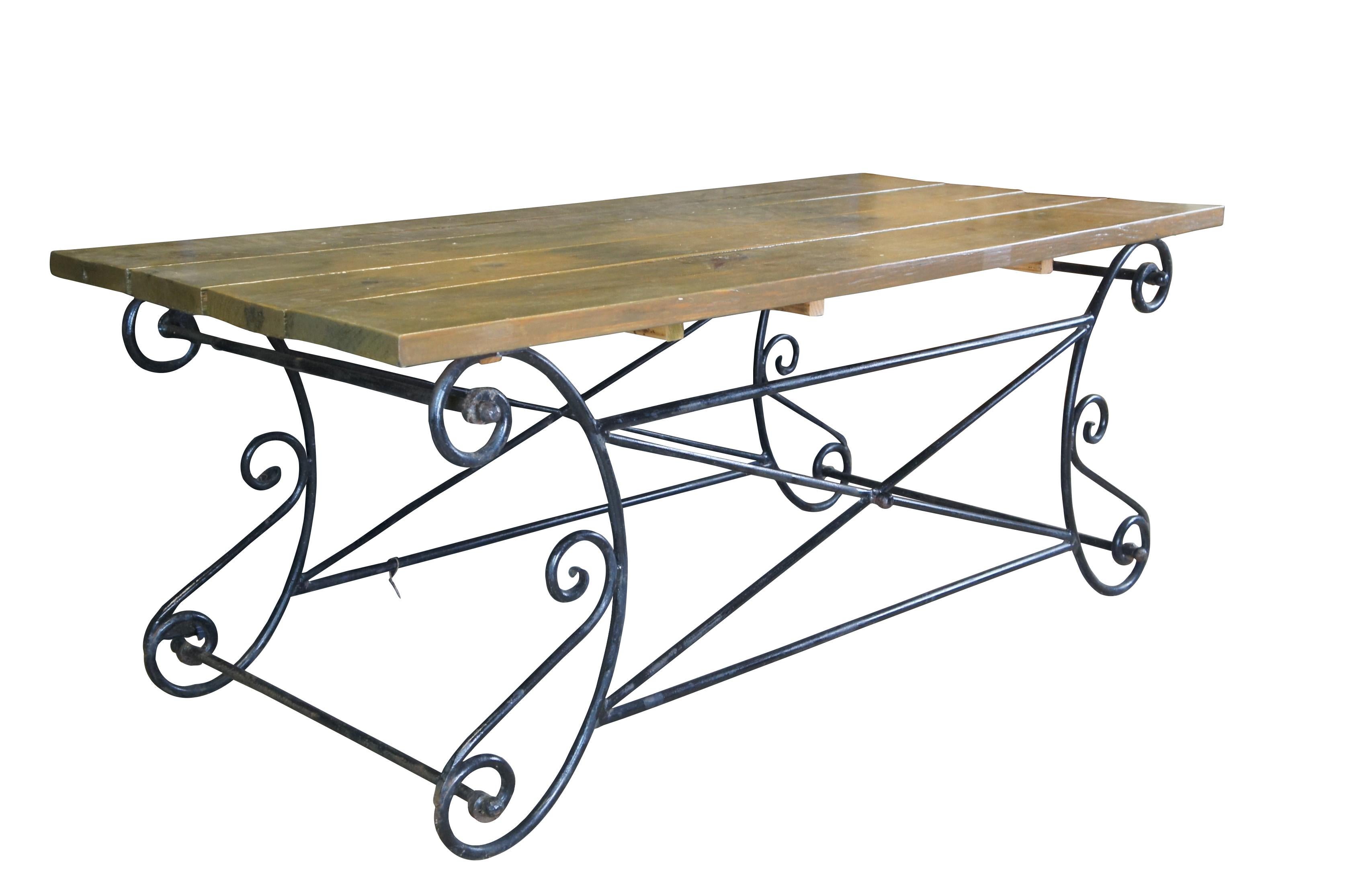 A nice blend of Neoclassical, Directoire and Farmhouse styling in this beautiful outdoor table. Made of iron featuring scrolled accents and pine plank top.

Dimensions:
72