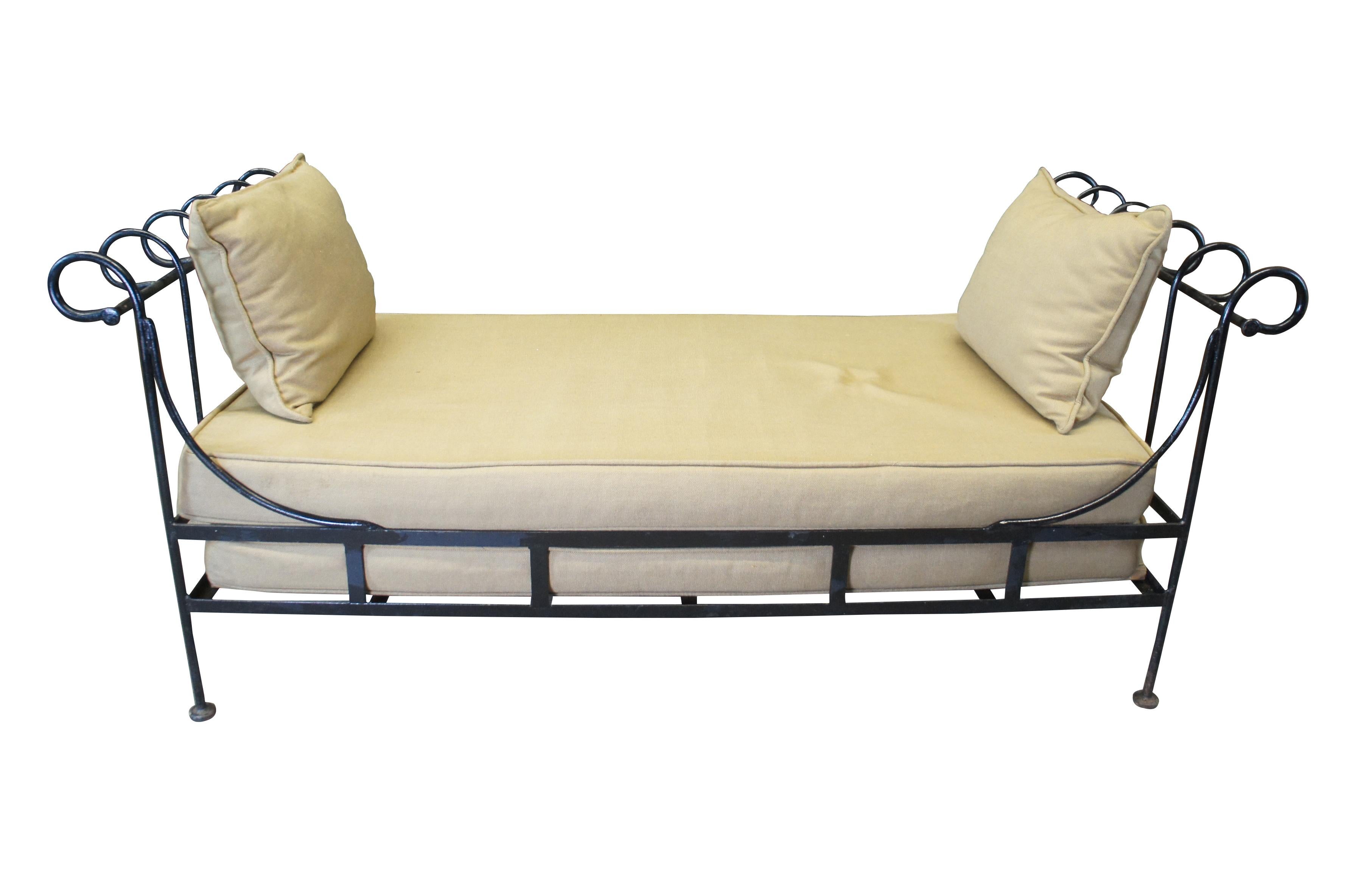 Vintage Neoclassical Directoire style outdoor settee daybed.  Made of iron featuring scrolled accents and waterproof cushions.

DIMENSIONS

31