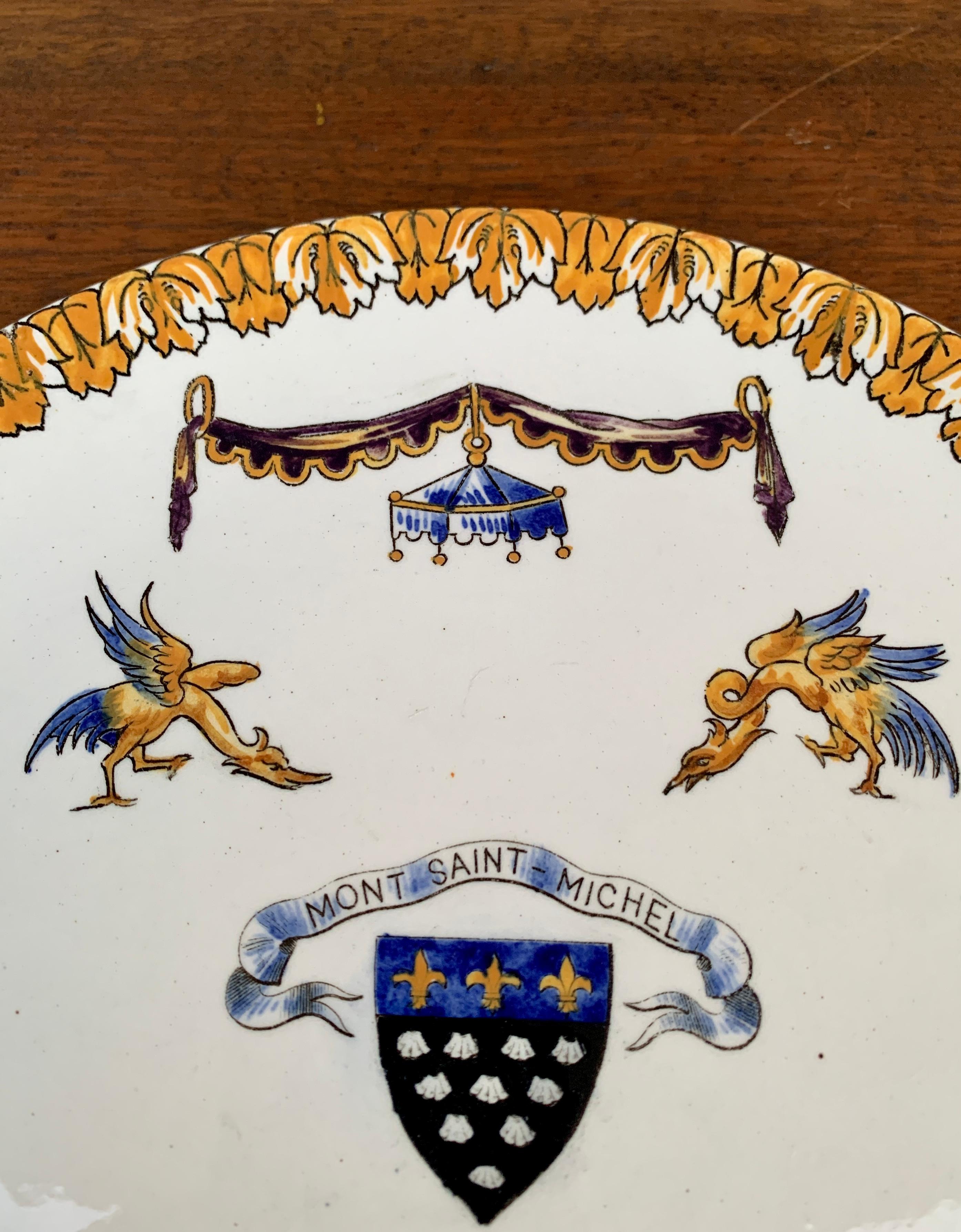 A gorgeous vintage Neoclassical style wall plate from Mont Saint Michel featuring stylized dolphins, birds, swags, and a center crest

France, Circa 1960s

Measures: 10