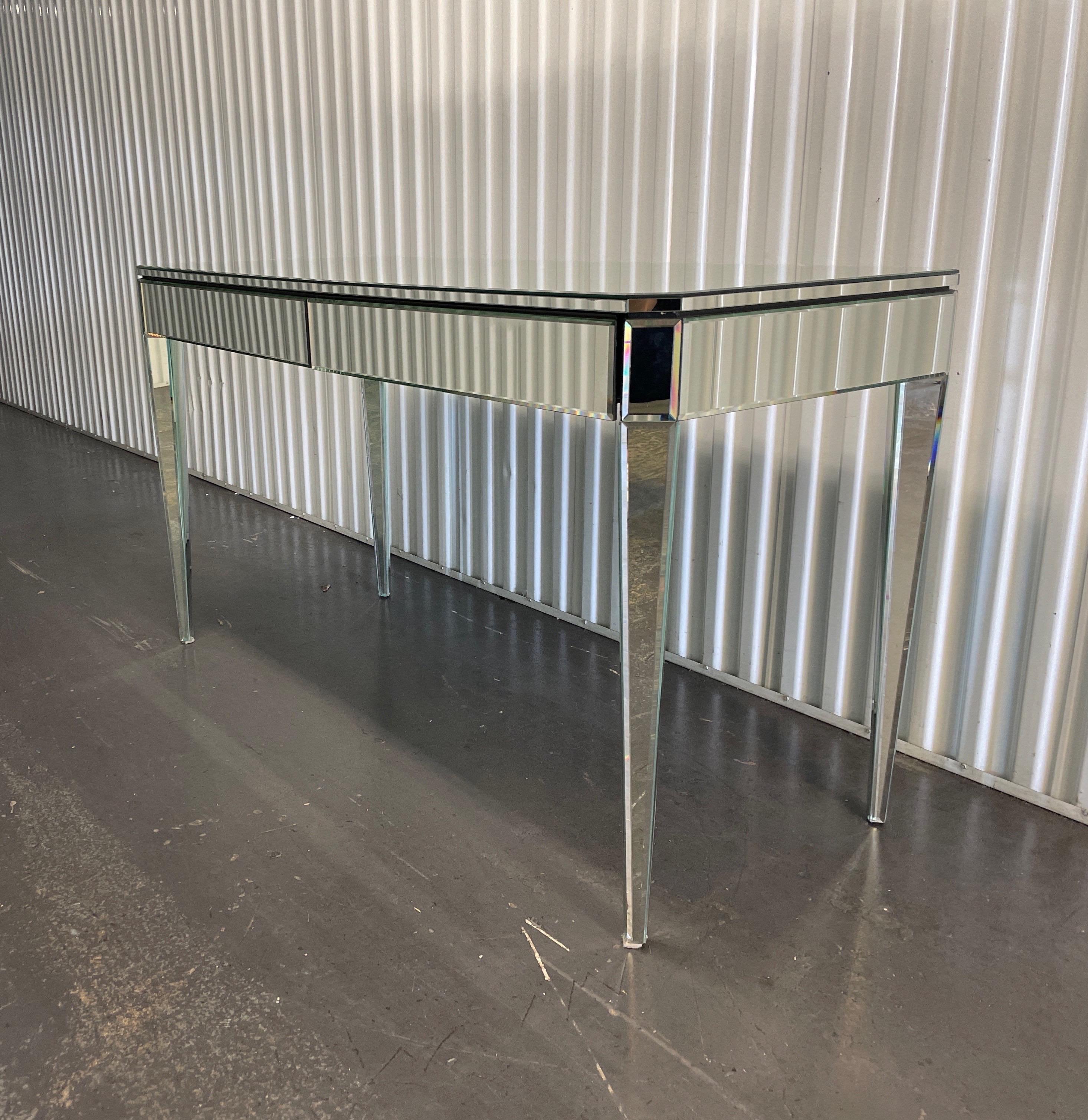 Very fine Neoclassical mirrored vanity table / desk by Nancy Corzine. Completely mirrored on all sides with elegant tapered legs.
