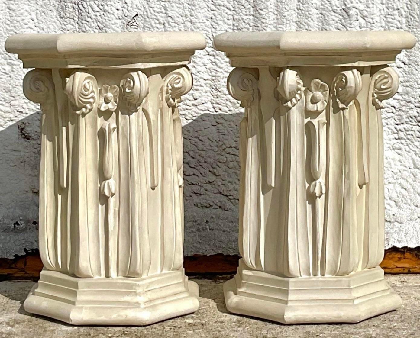 This ornately detailed pedestal adds a quick sense of class to any room. At its height it can be used as either a table base or a freestanding pedestal. The scroll drapery detailing is elegant while whimsy perfect to add into so many different